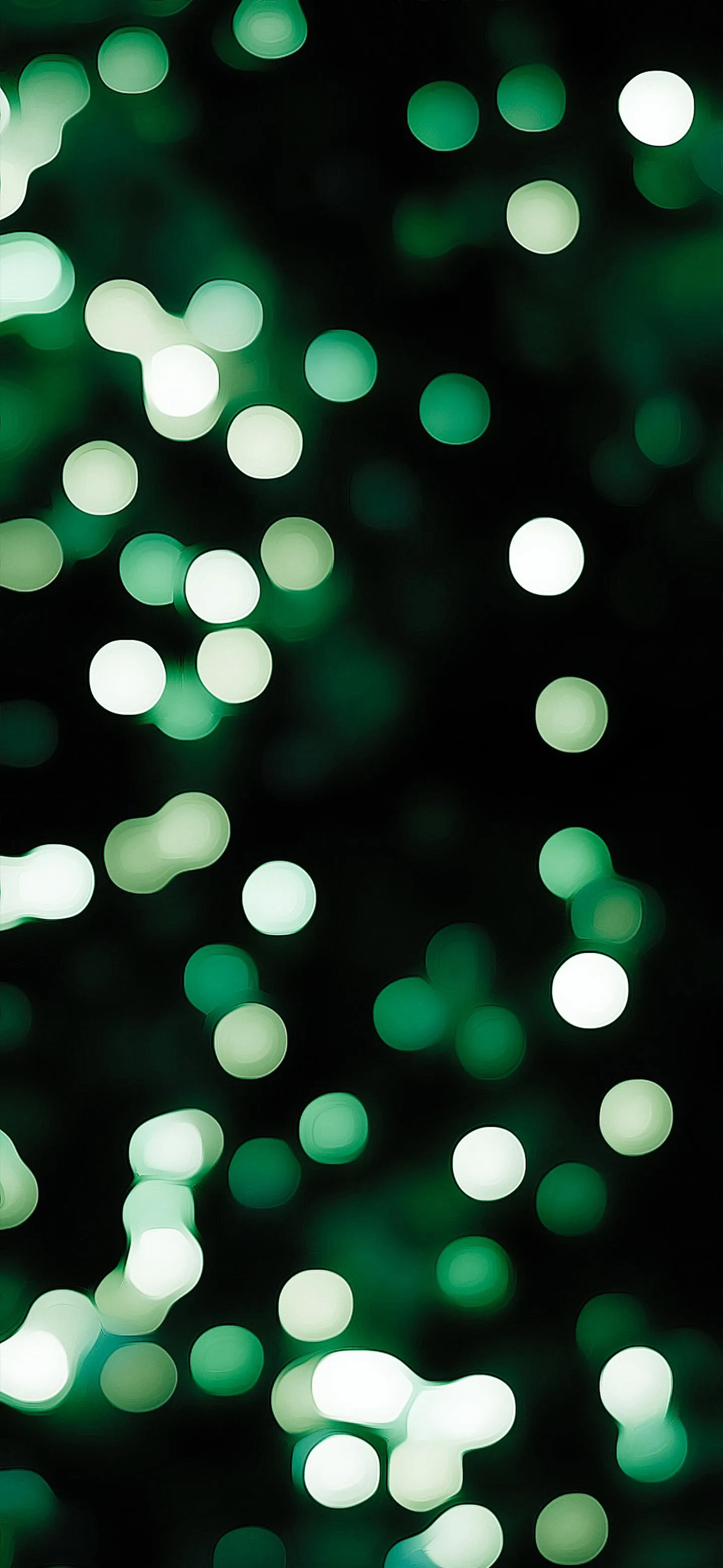 Green Glowing Bokeh Lights in Soft Abstract Pattern