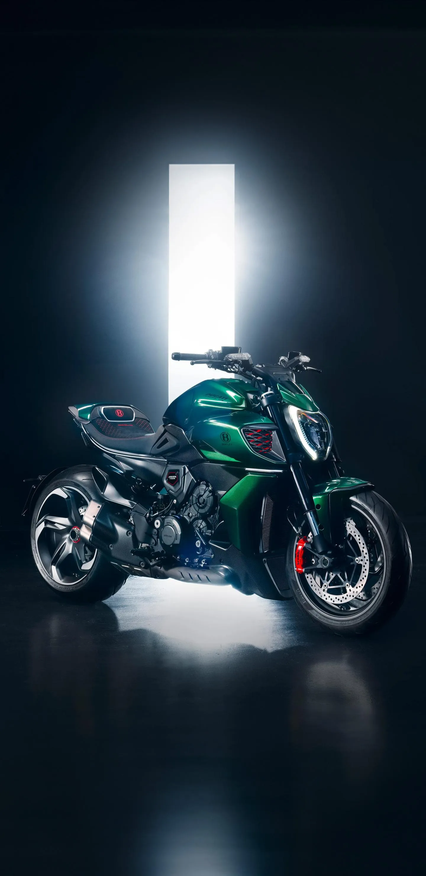 Green Motorcycle With Bright Light On Dark Road At Night