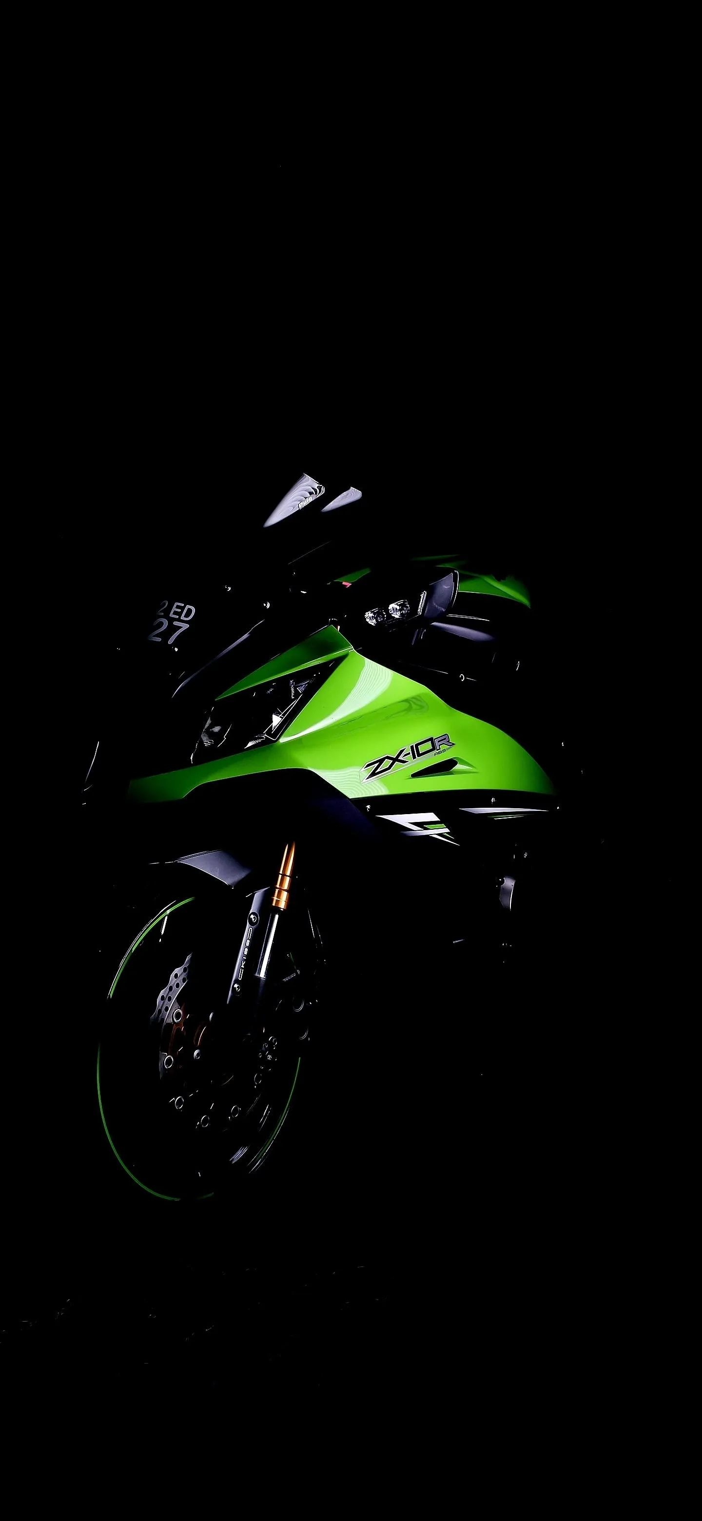 Green Sports Bike Shining in Midnight Darkness Wallpaper