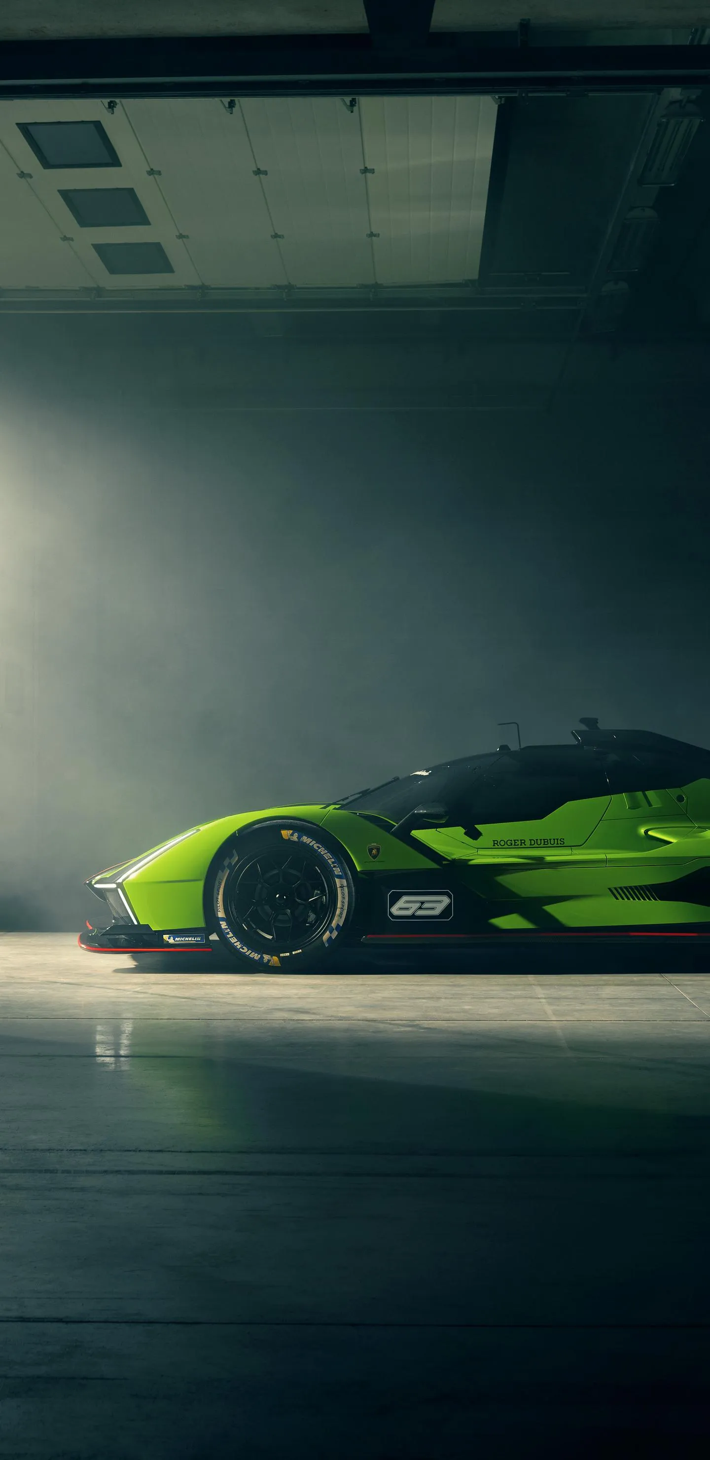 Green Sports Car Parked in Futuristic Underground Lot