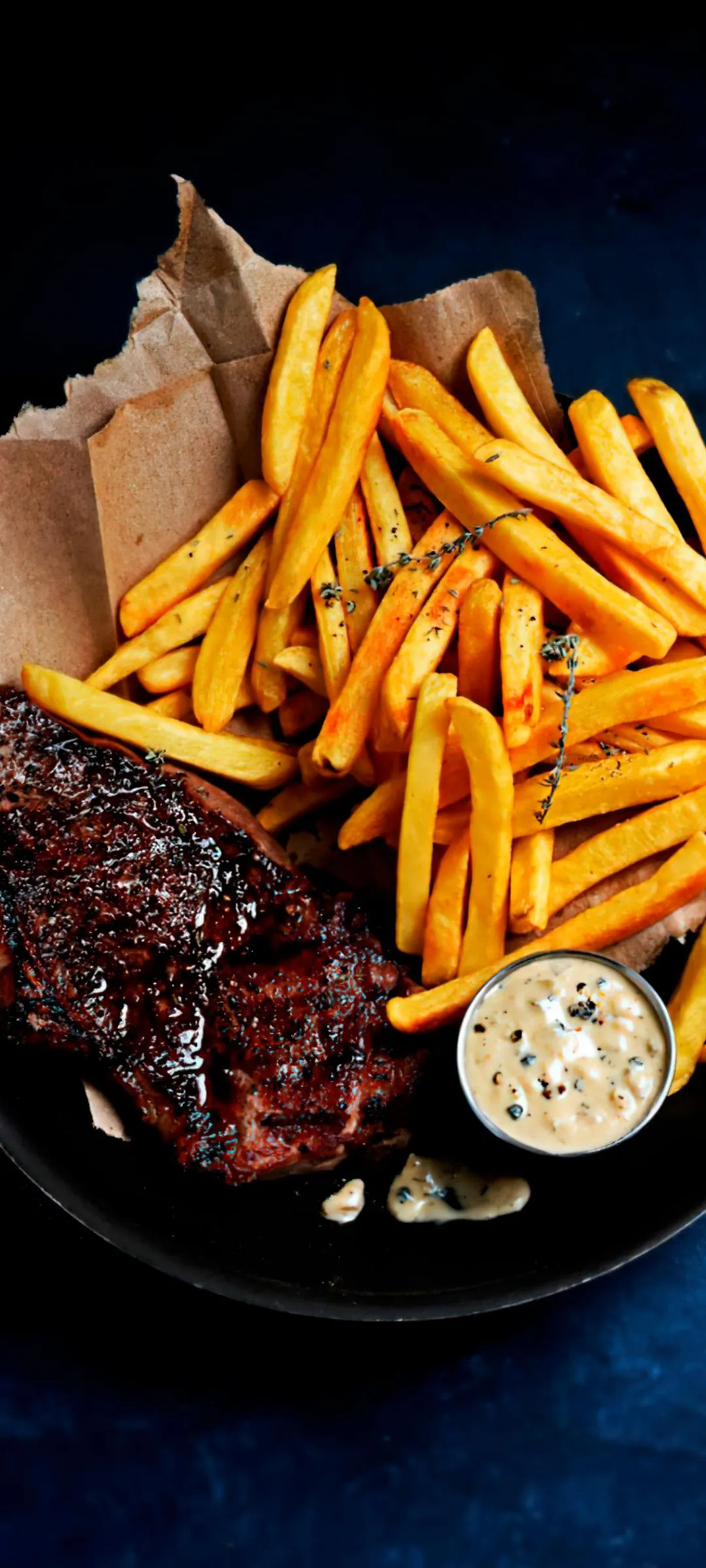 Grilled Steak with French Fries on Wooden Plate Table