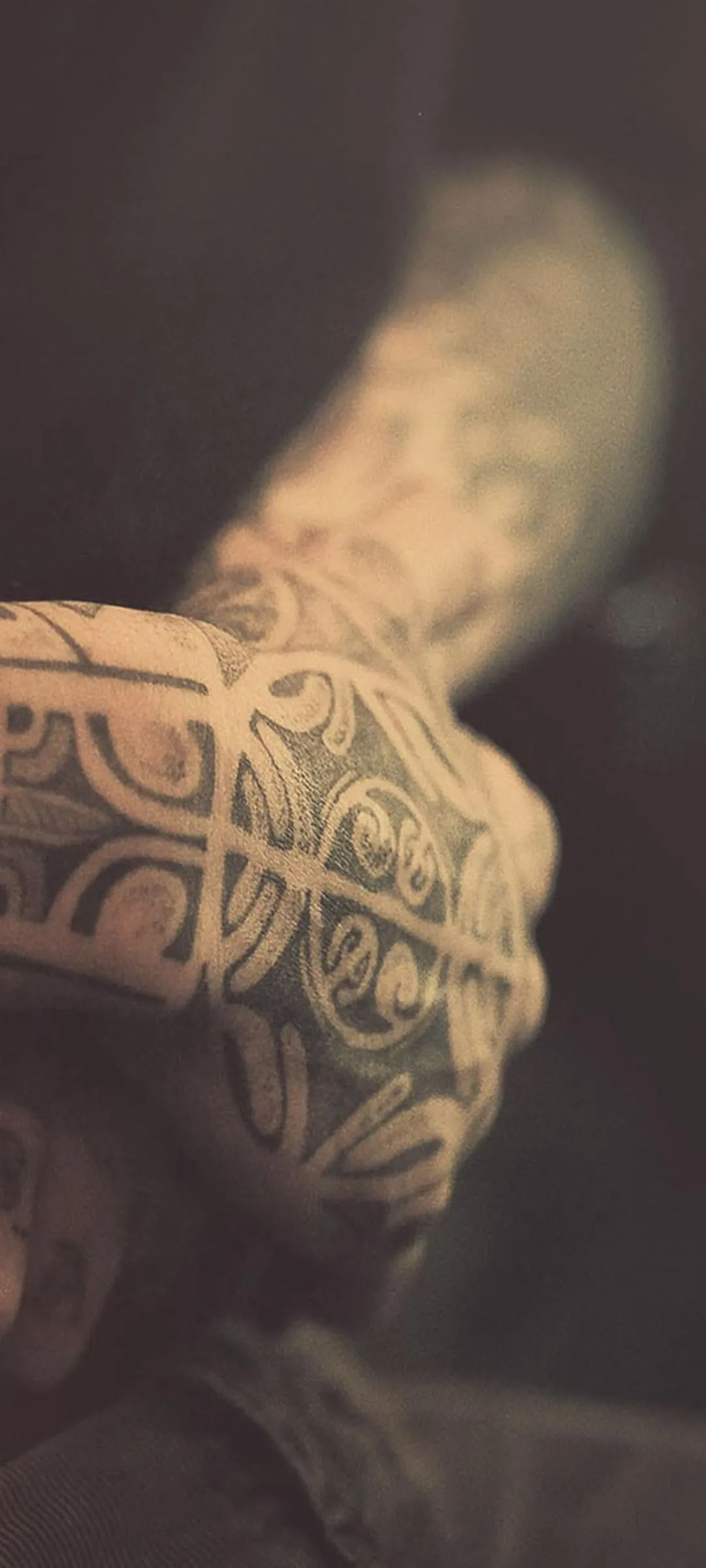 Hand Holding Light in Artistic Warm Tone Lighting Wallpaper