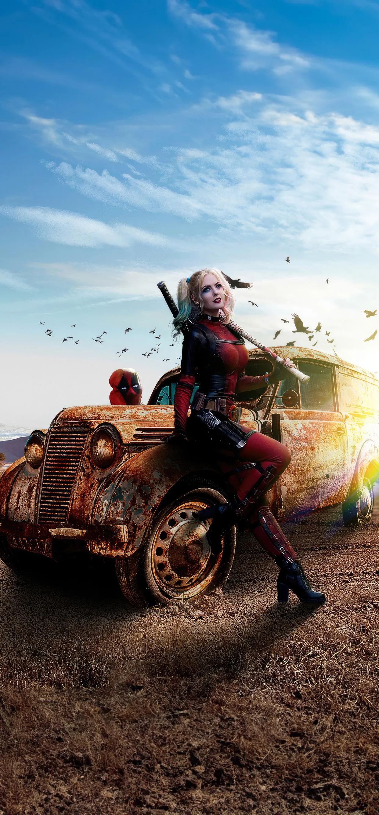 Harley Quinn with Deadpool Costume Near Rusty Car in Desert