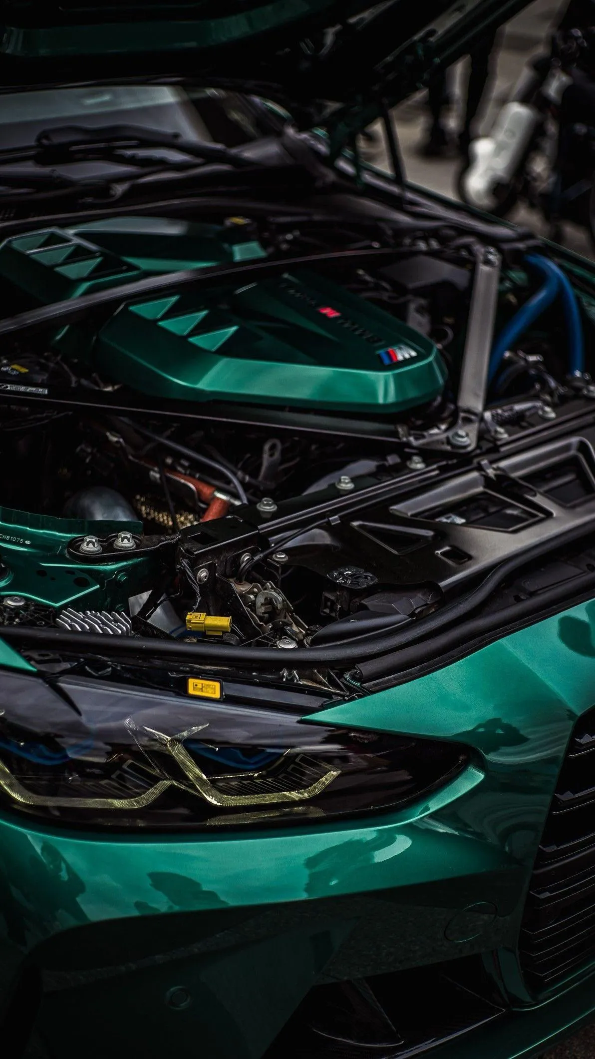 High Performance BMW Engine in Striking Green Hood Wallpaper
