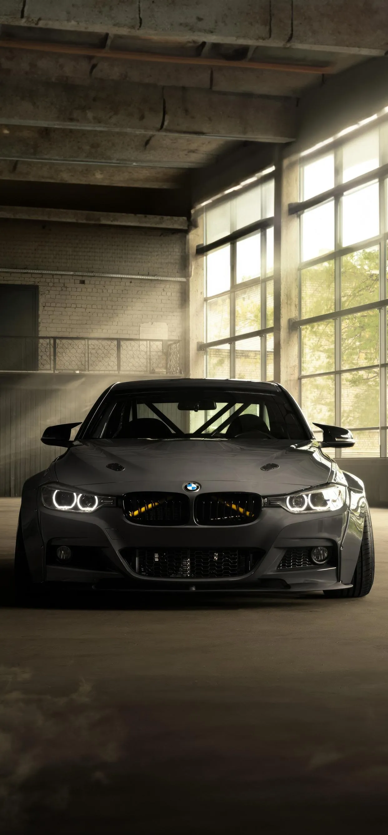 High Performance Car in Dimly Lit Parking Area Wallpaper