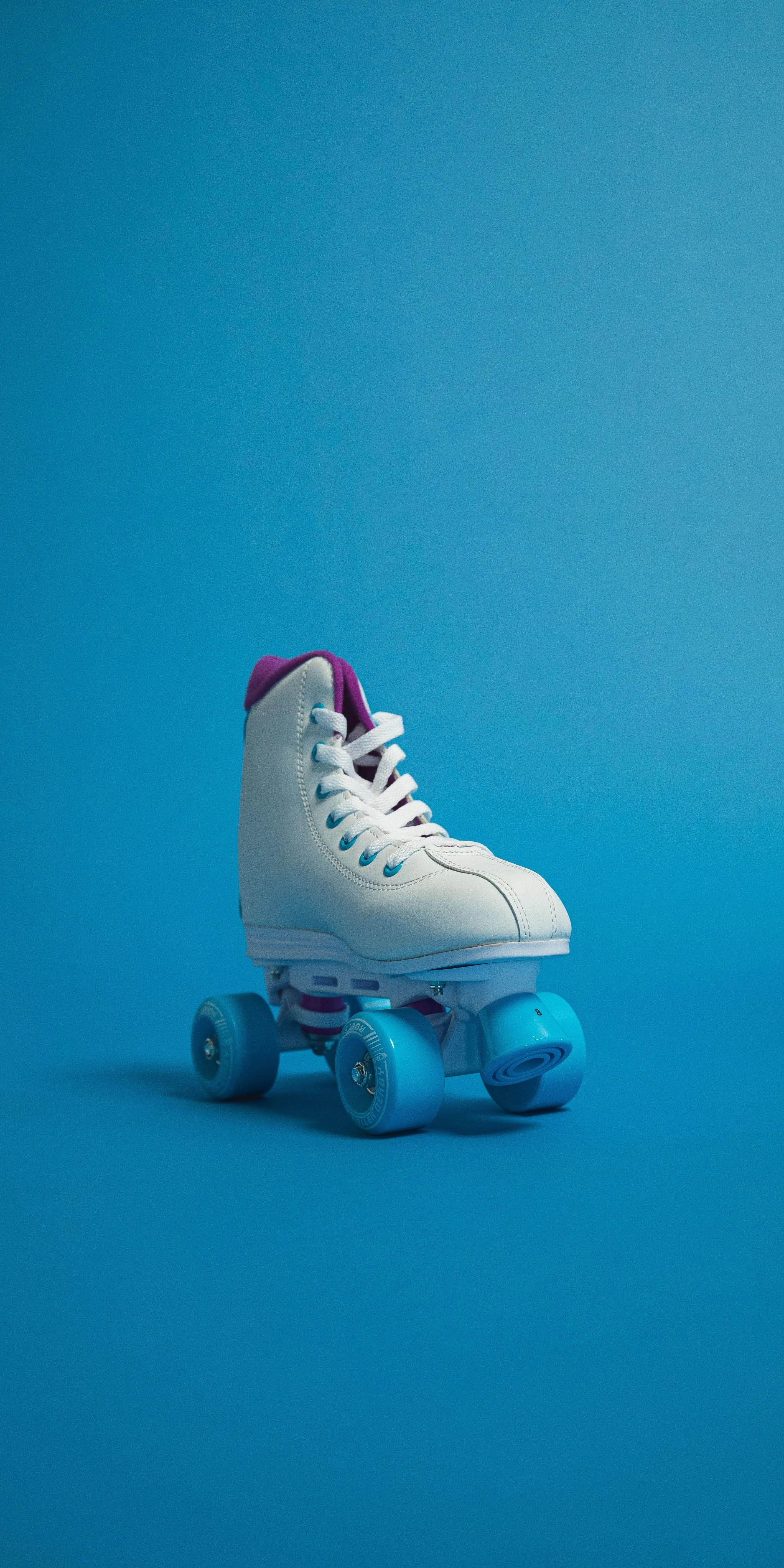 High Quality Retro White Roller Skate on Blue Background