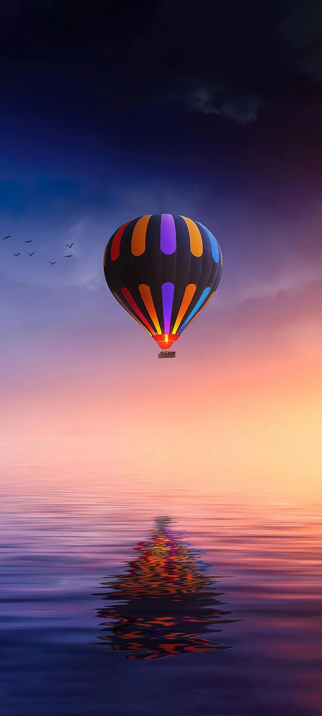 Hot Air Balloon Floating in a Peaceful Sunset Sky Wallpaper