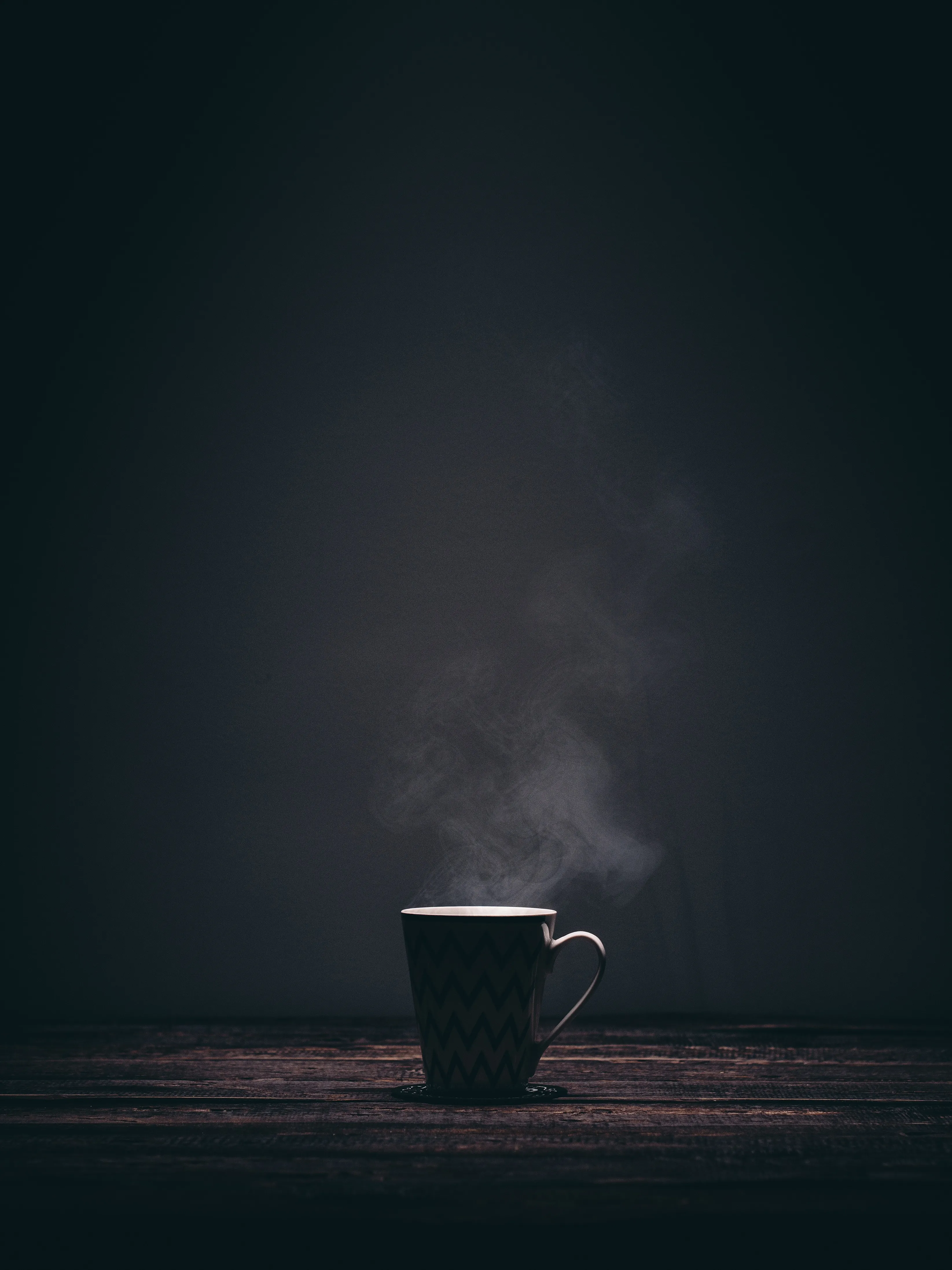 Hot Coffee Steaming in Dark Minimalist Background Download
