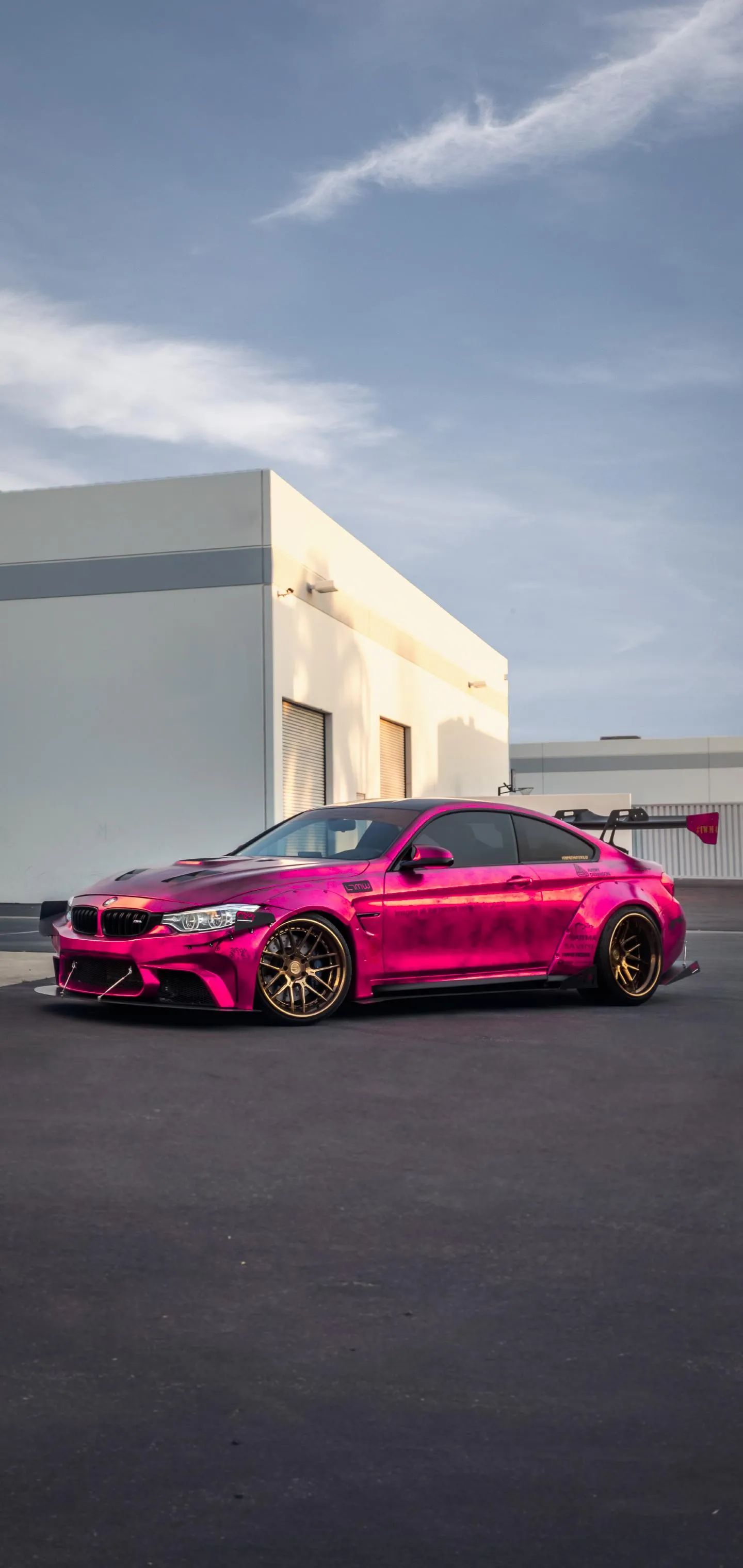 Hot Pink Car Parked Outside White Urban Building Wallpaper