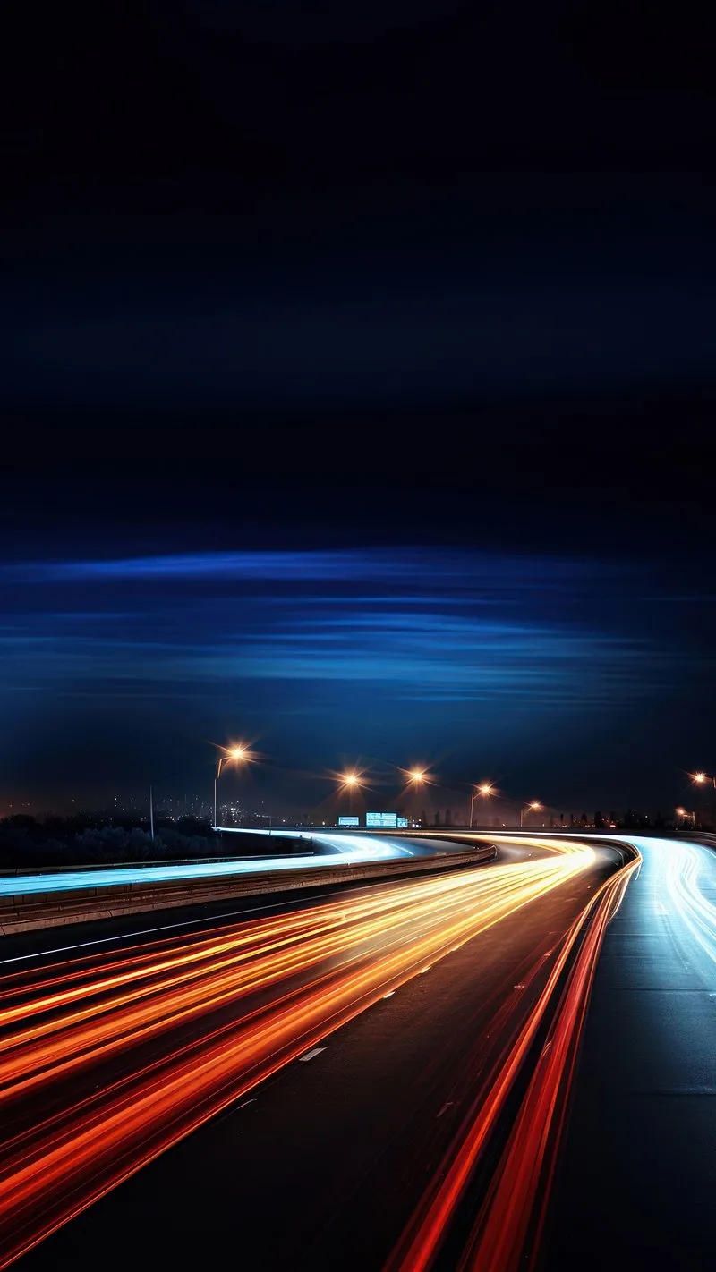 Light Trails Streaming Across Highway in Vibrant Night Scene