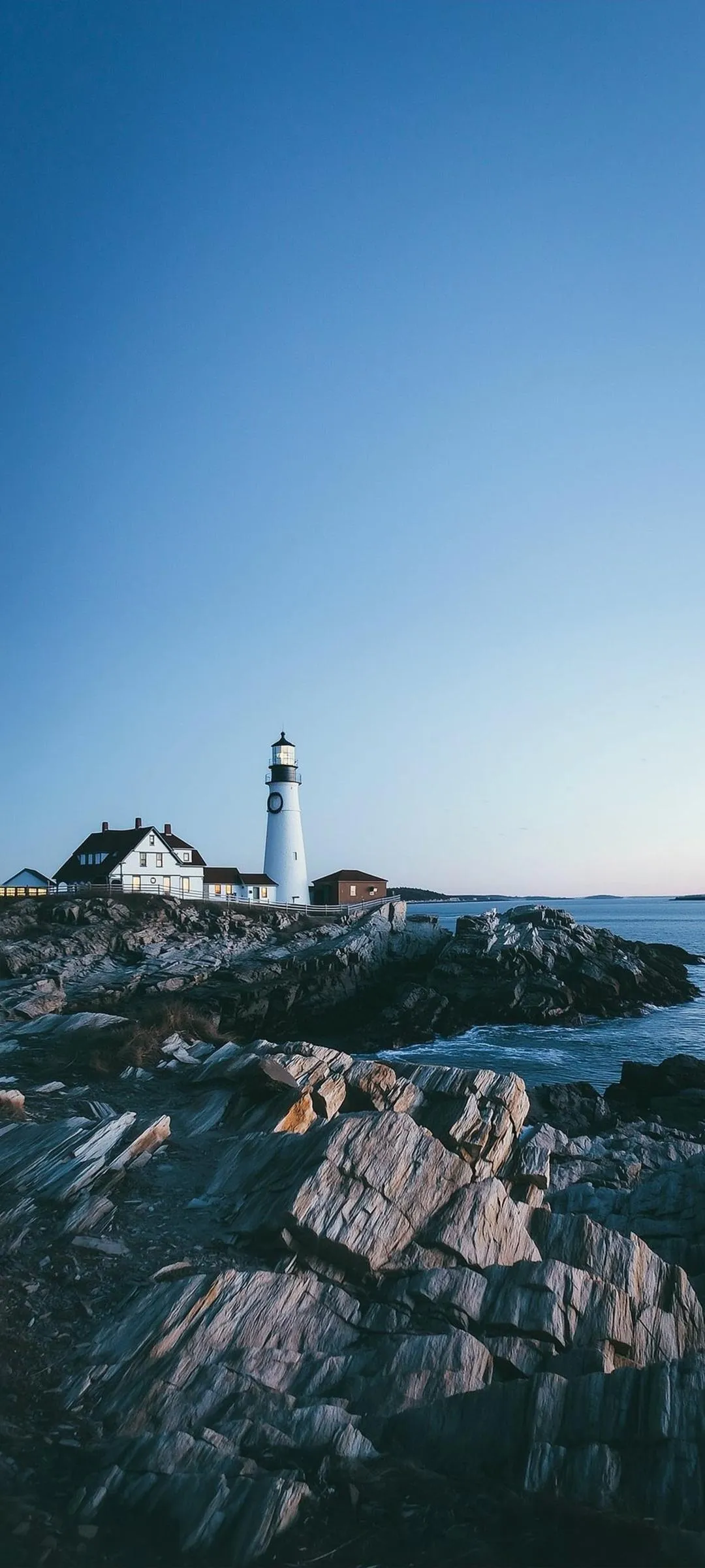 Lone Lighthouse Standing on a Rugged Coastal Cliff
