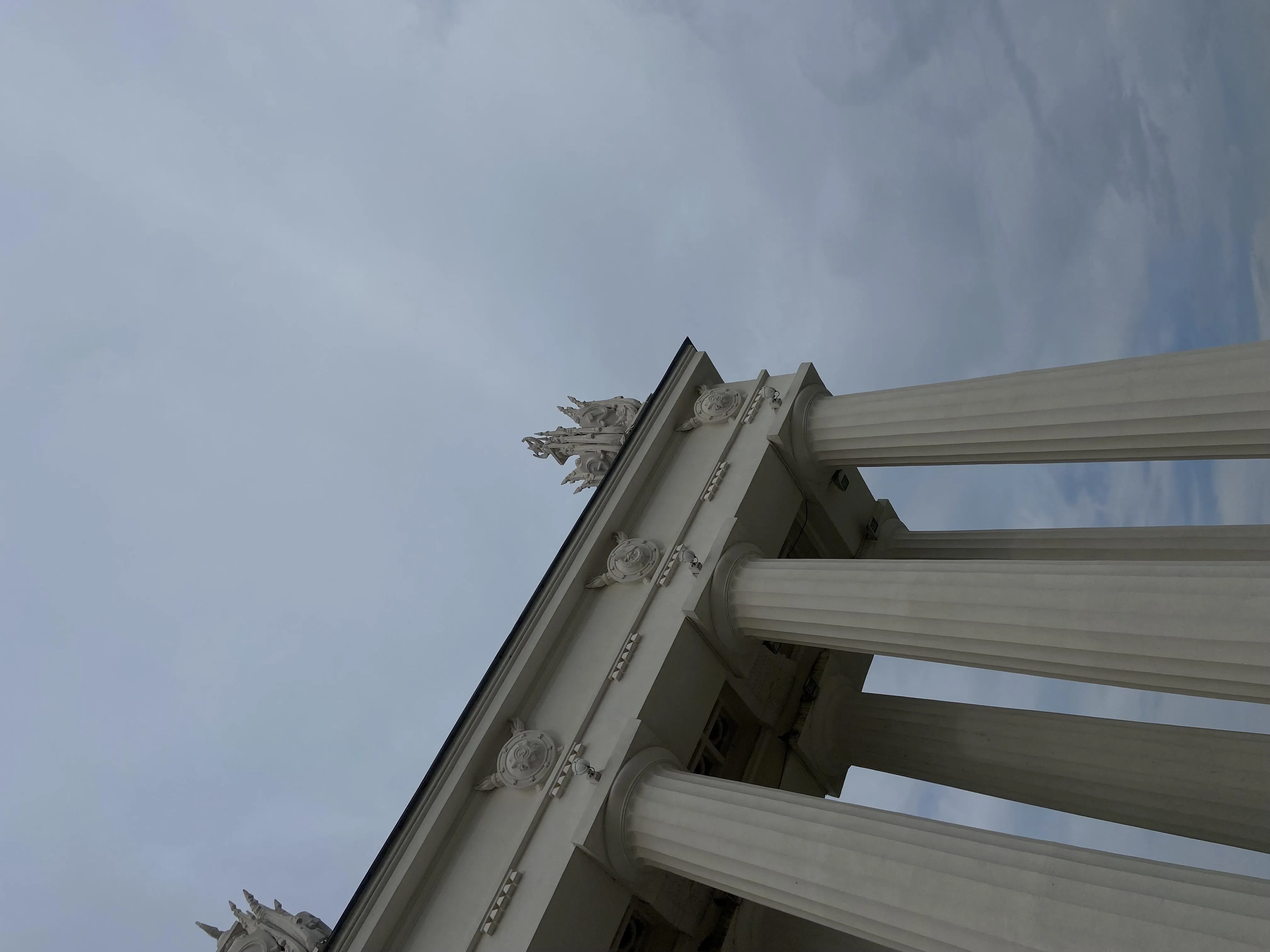 Low Angle View of Classical Building Columns Against Sky