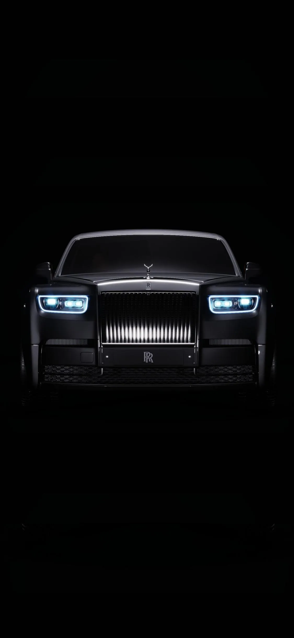 Luxury Black Car Illuminated in Dark Street Lights