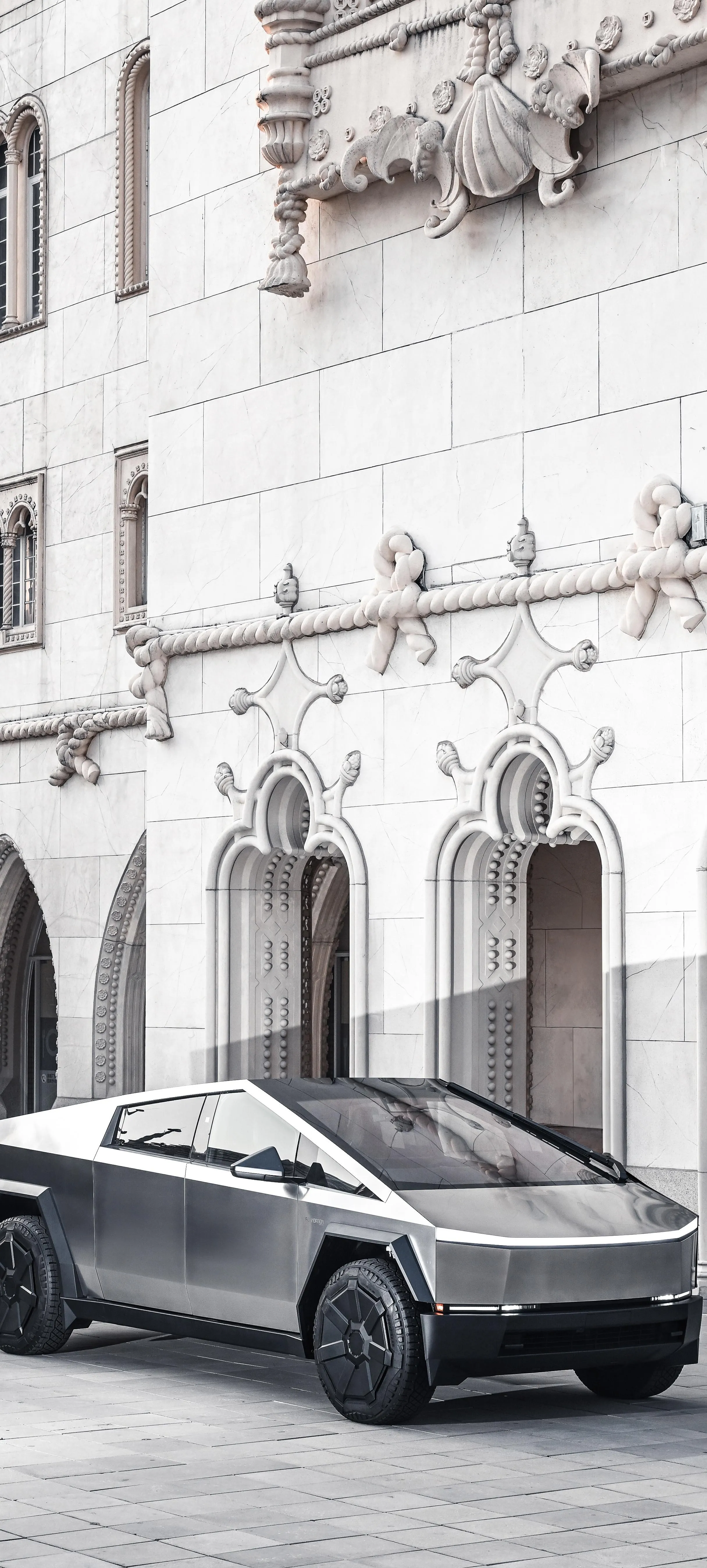 Luxury Car Parked Outside Classic European Building Image
