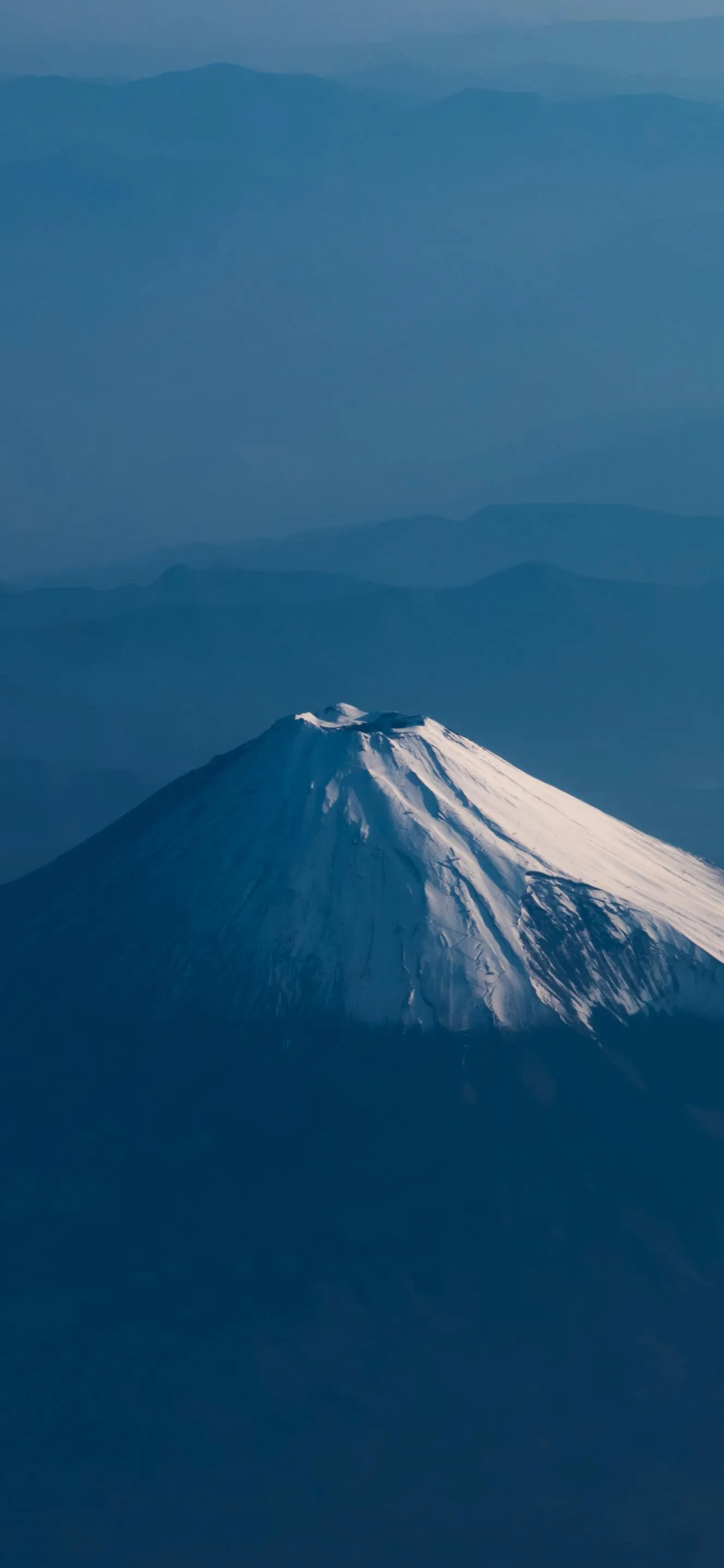 Majestic Snow Covered Mountain with Clear Blue Sky Wallpaper