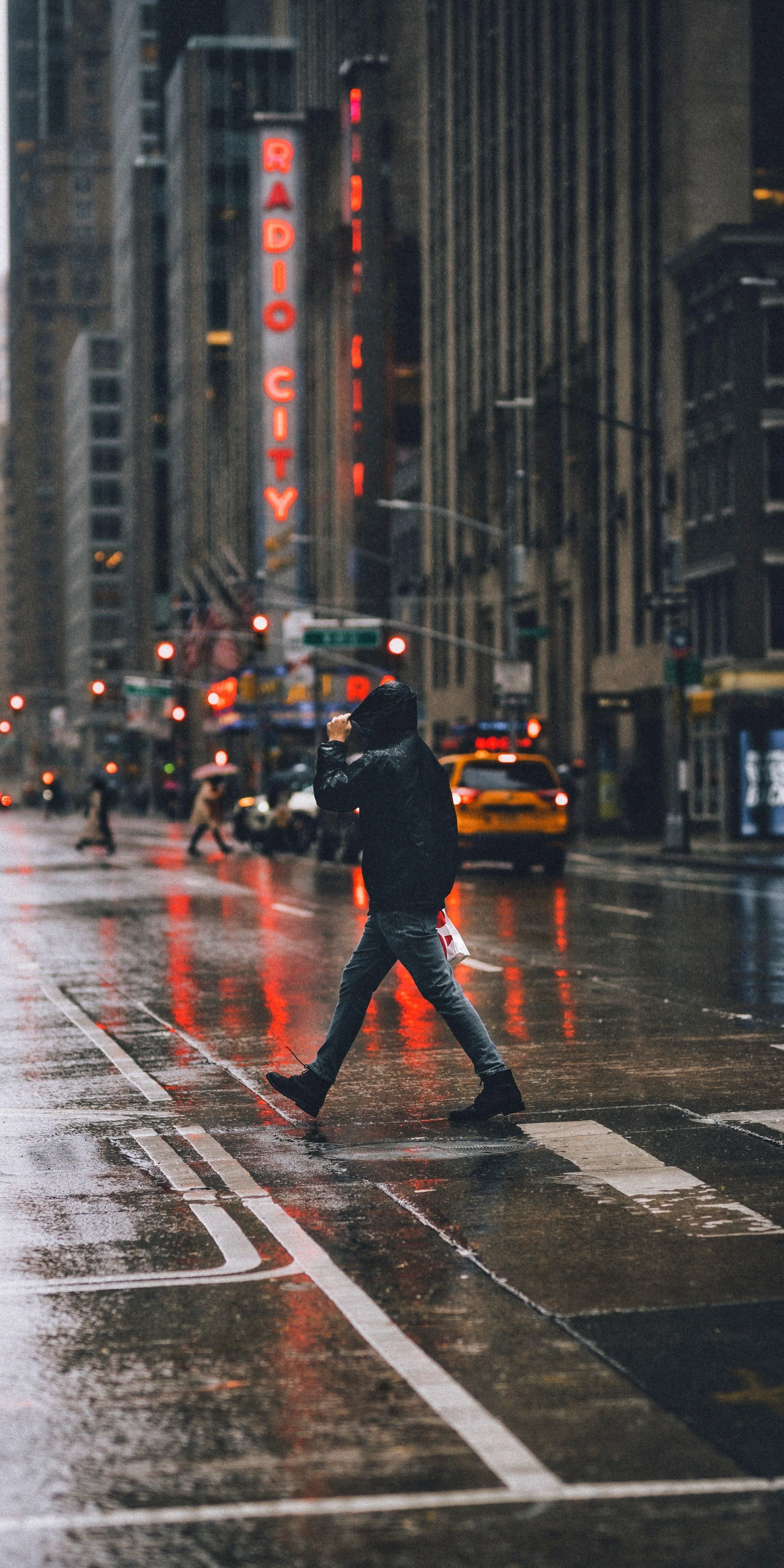 Man Walking in Rainy City Street at Twilight Wallpaper HD