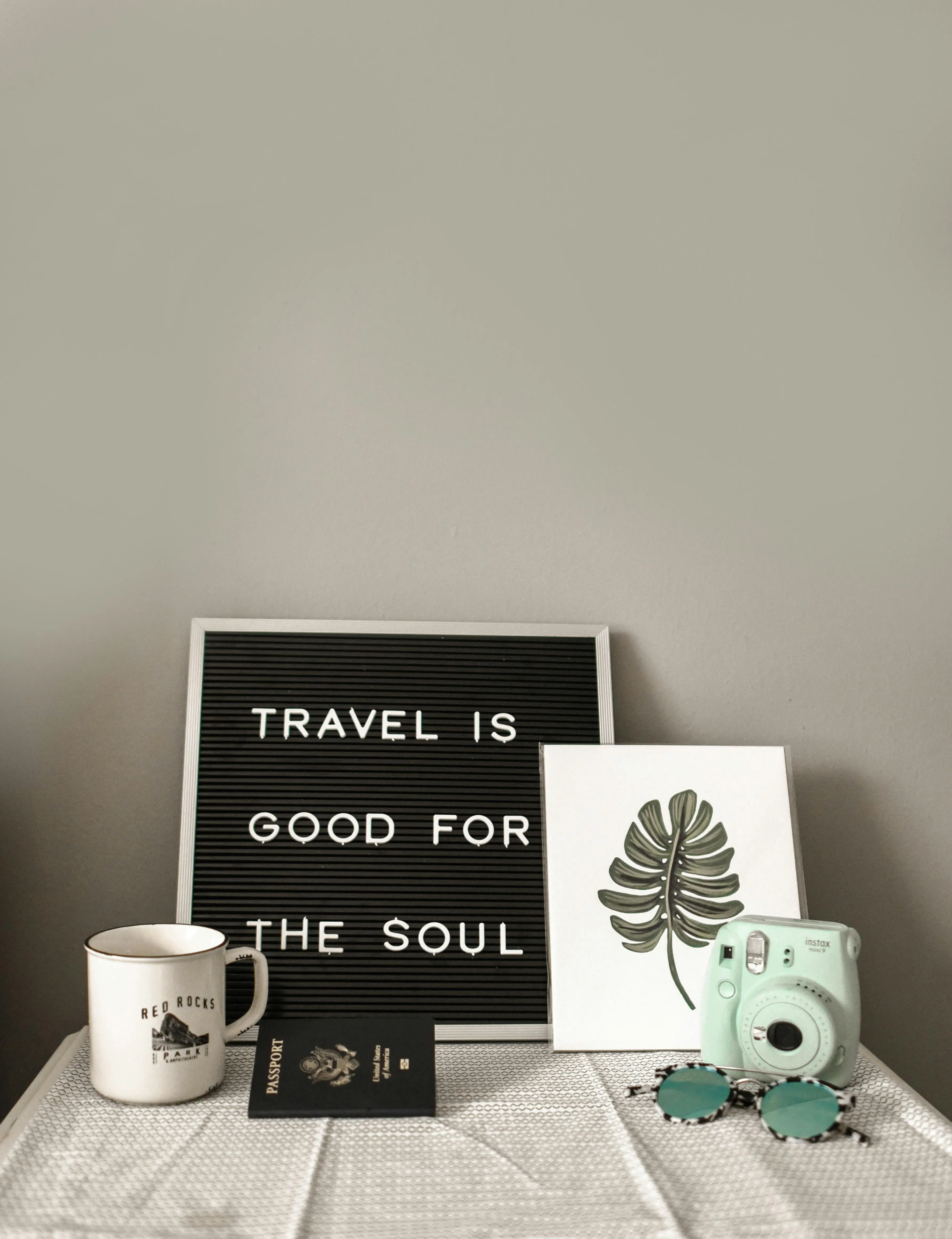 Minimal Workspace with Travel and Book Decor Wallpaper