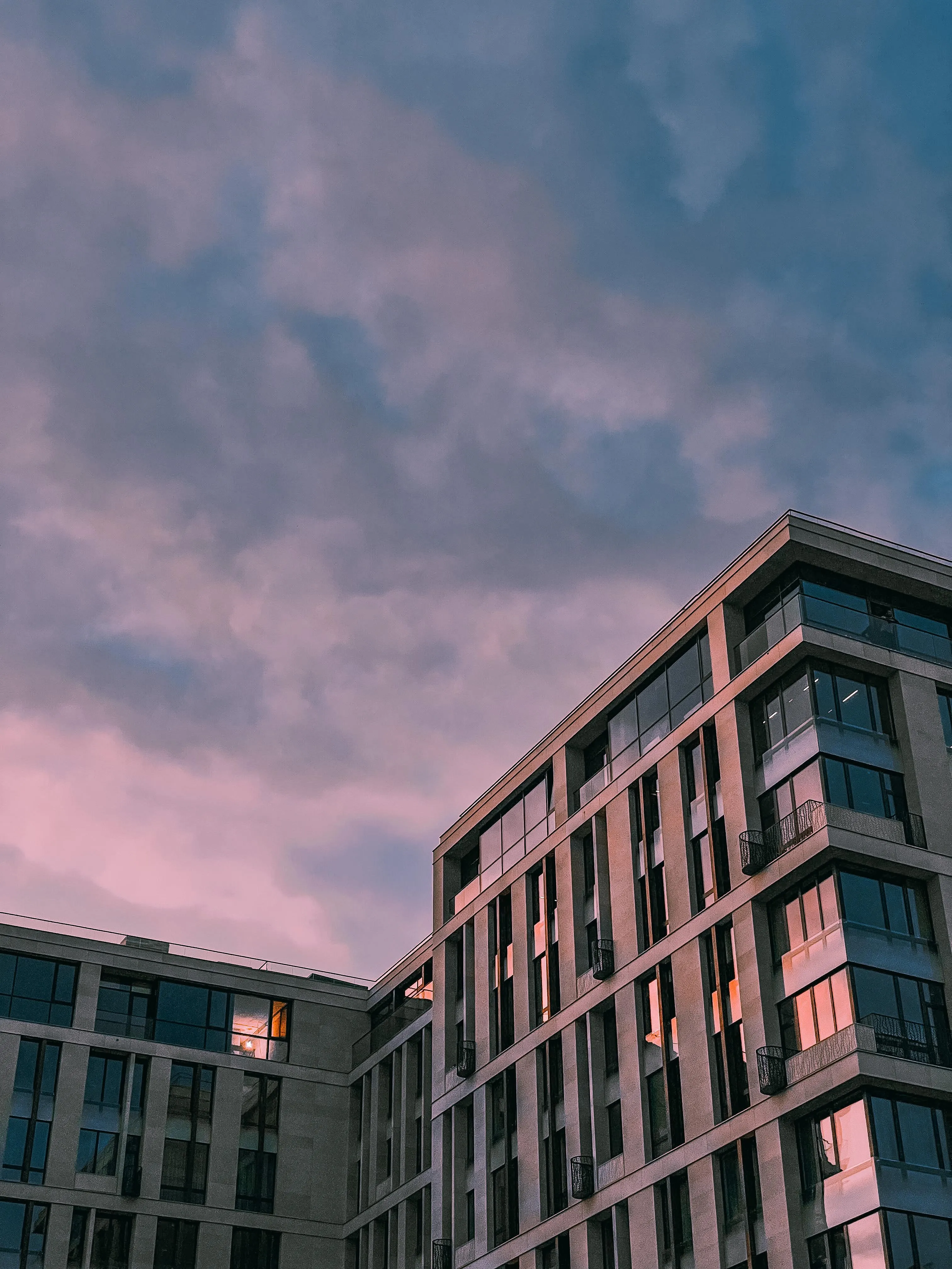 Modern Building Architecture Against a Moody Sky Background