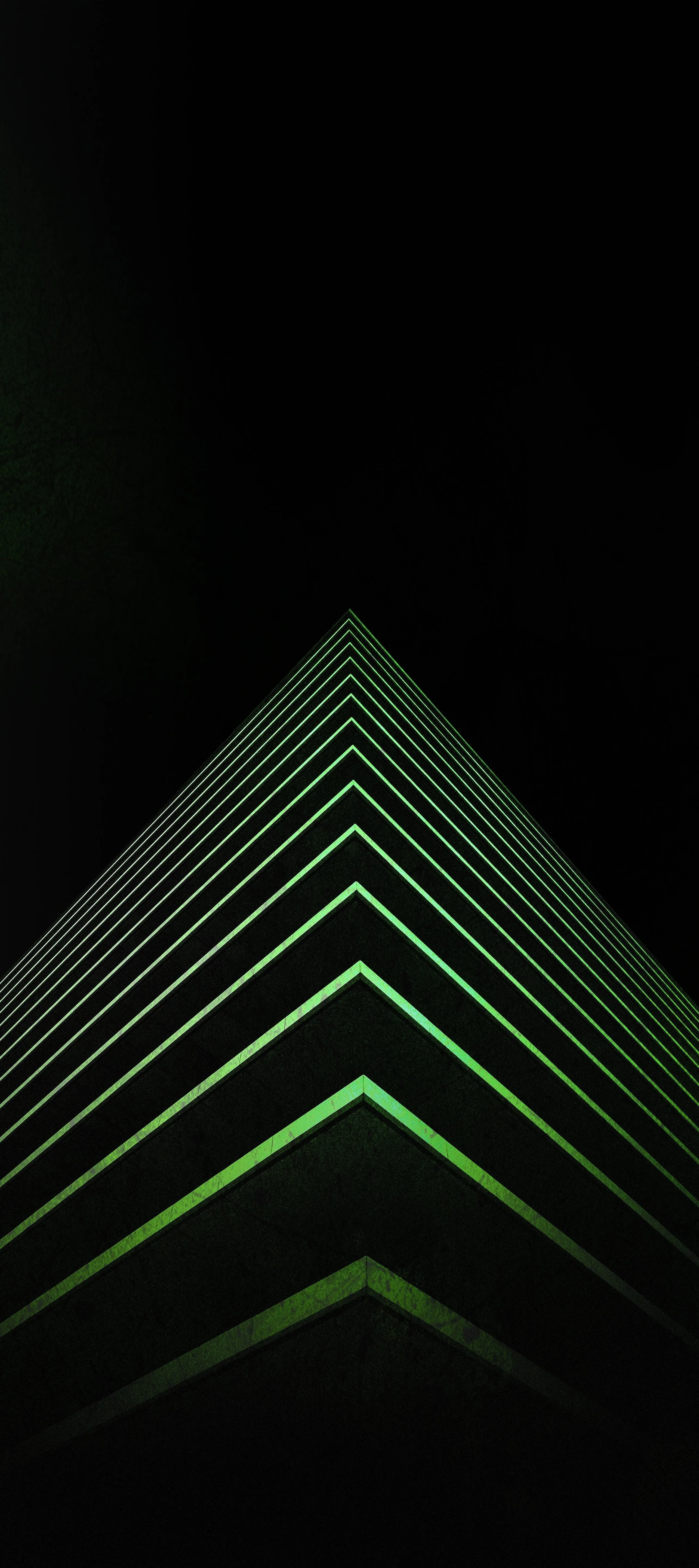 Modern Green Lit Skyscraper with Futuristic Design Image