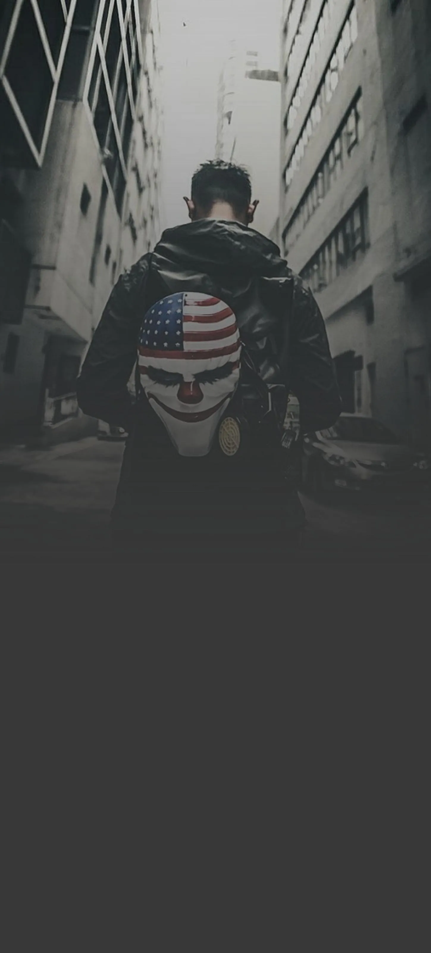 Moody Street Portrait of Man in Urban Darkness Wallpaper