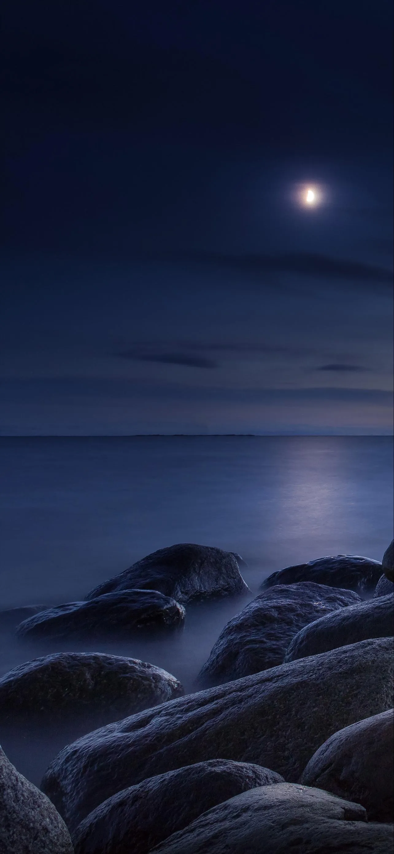 Moonlit Ocean with Clouds and Gentle Night Sky Wallpaper
