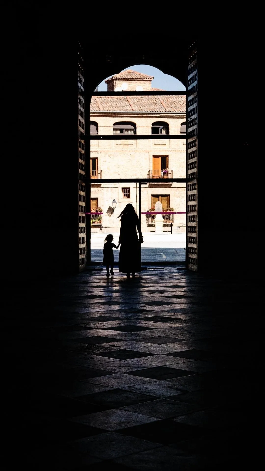 Mother and Child Walking Toward Light of New Day Image