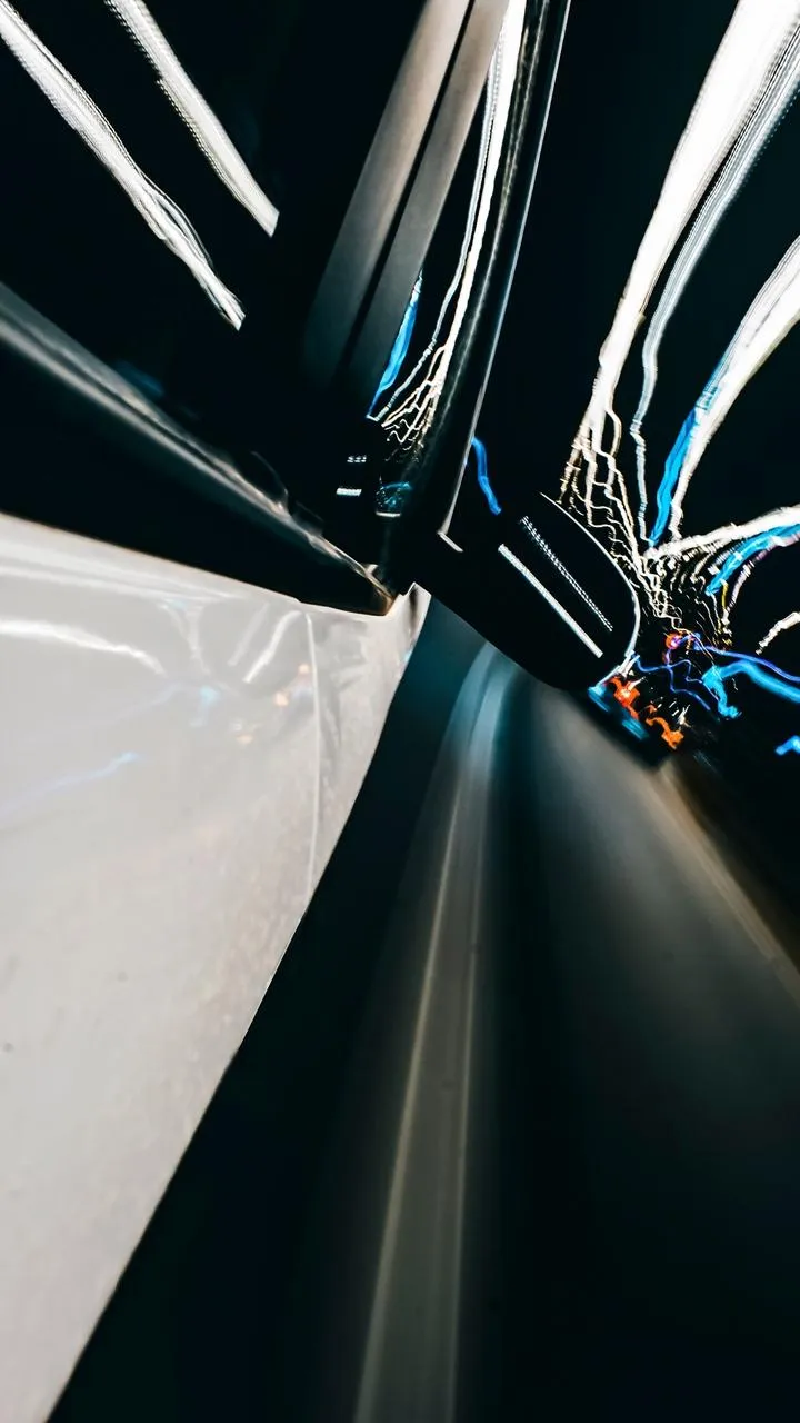 Motion Blur Night City Lights from a Speeding Car Wallpaper