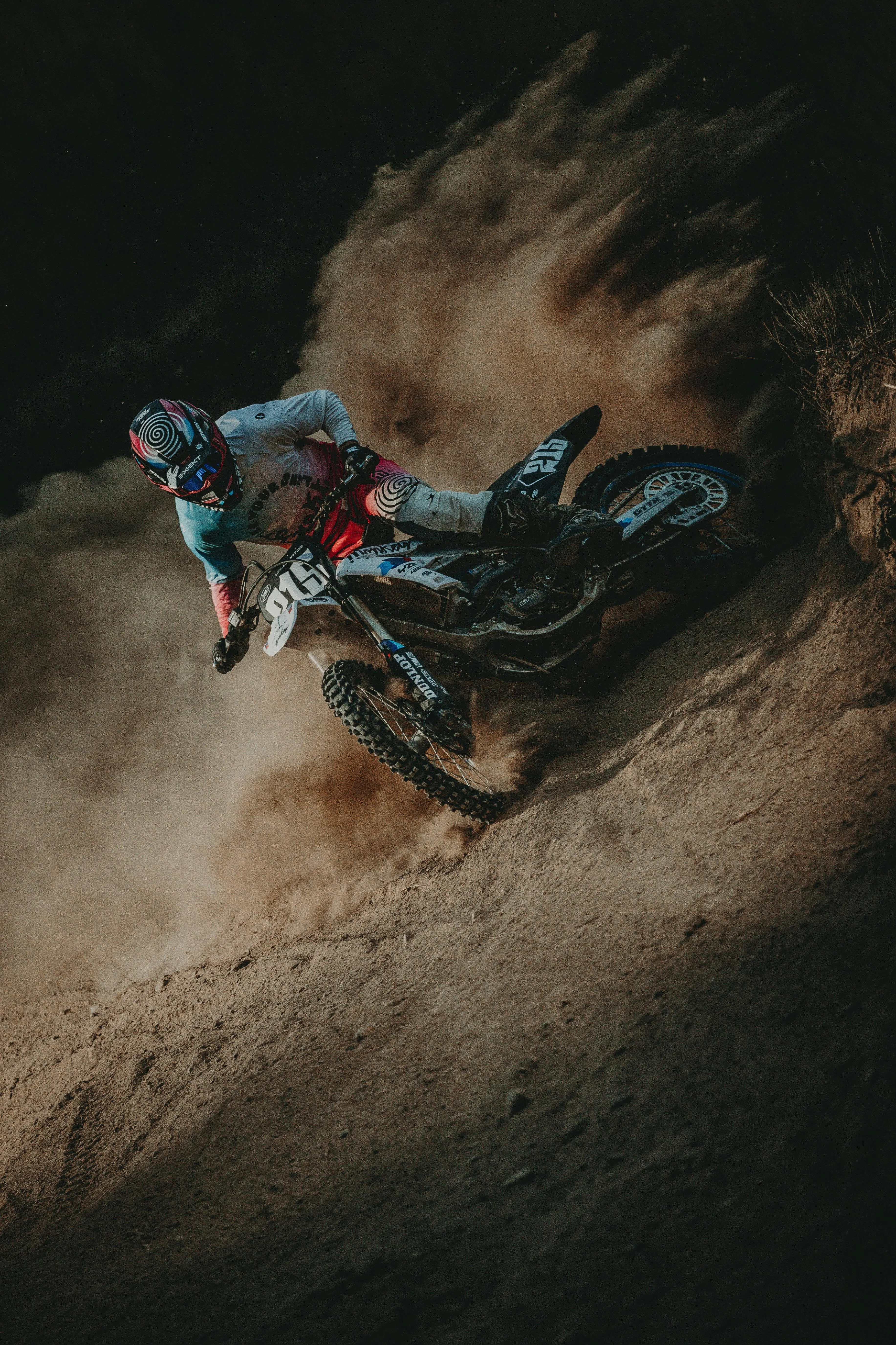 Motocross Rider Drifting in Desert Sand at High Speed