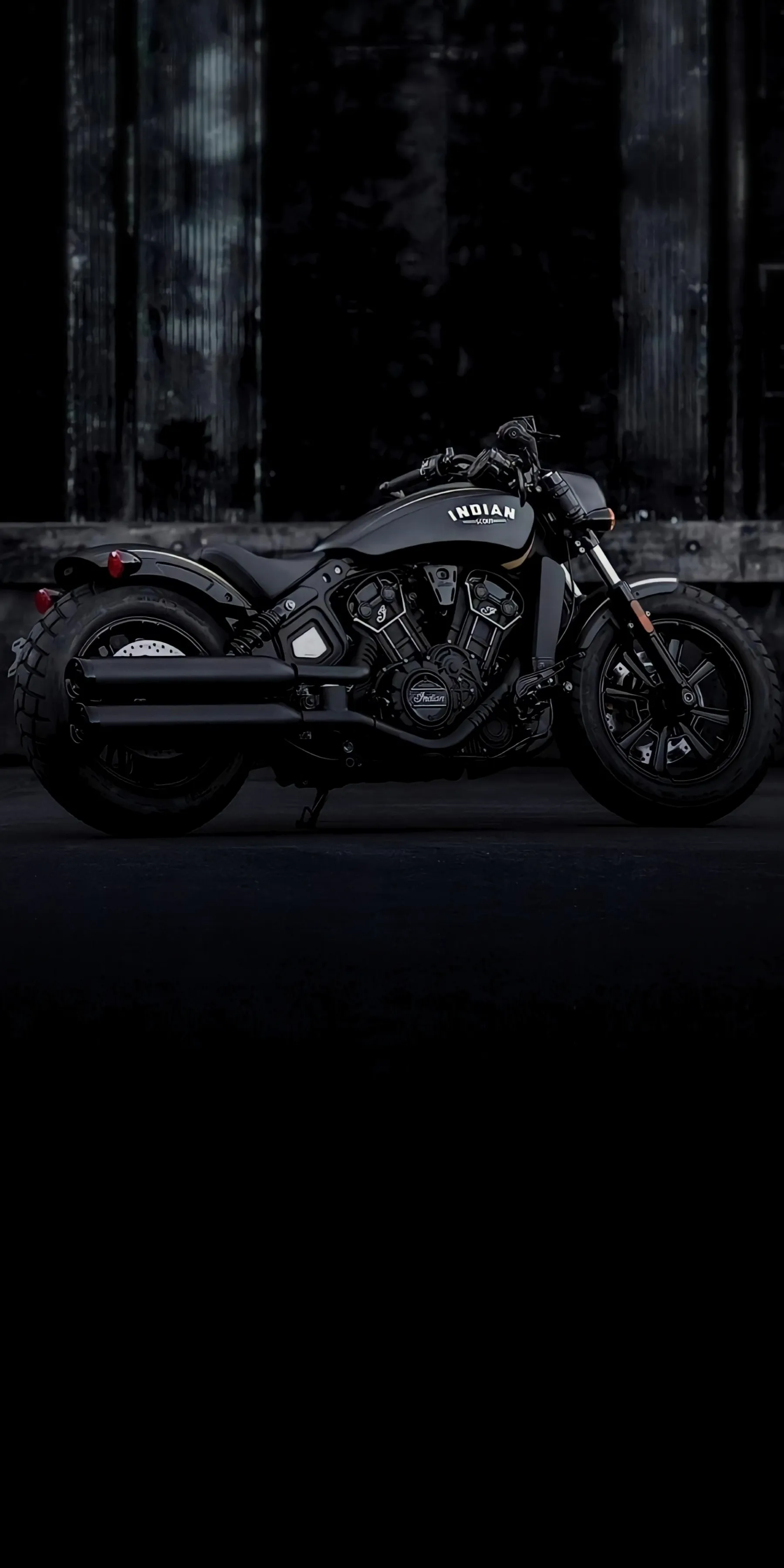 Motorcycle in Darkness with Subtle Light Glow Wallpaper