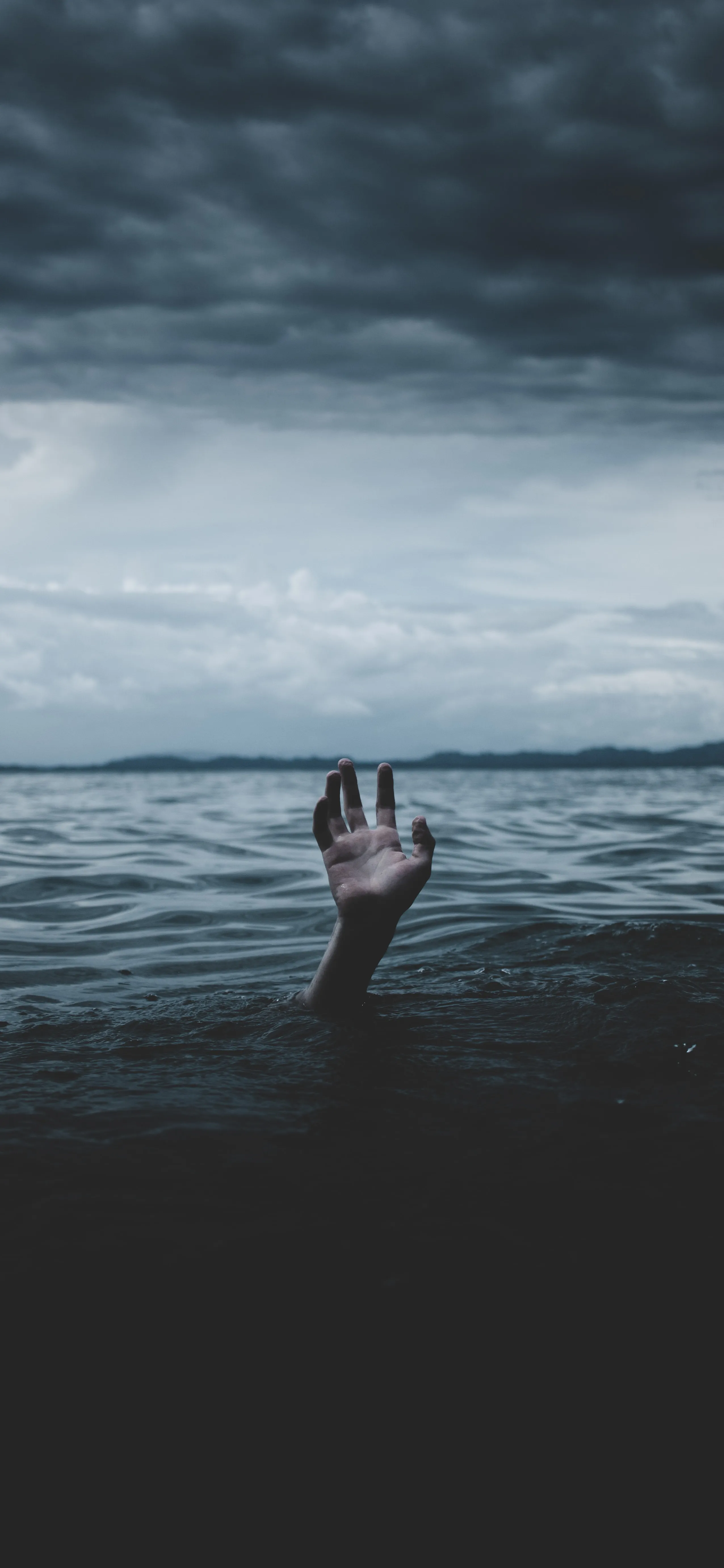 Mysterious Hand Reaching Out from Dark Ocean Waters