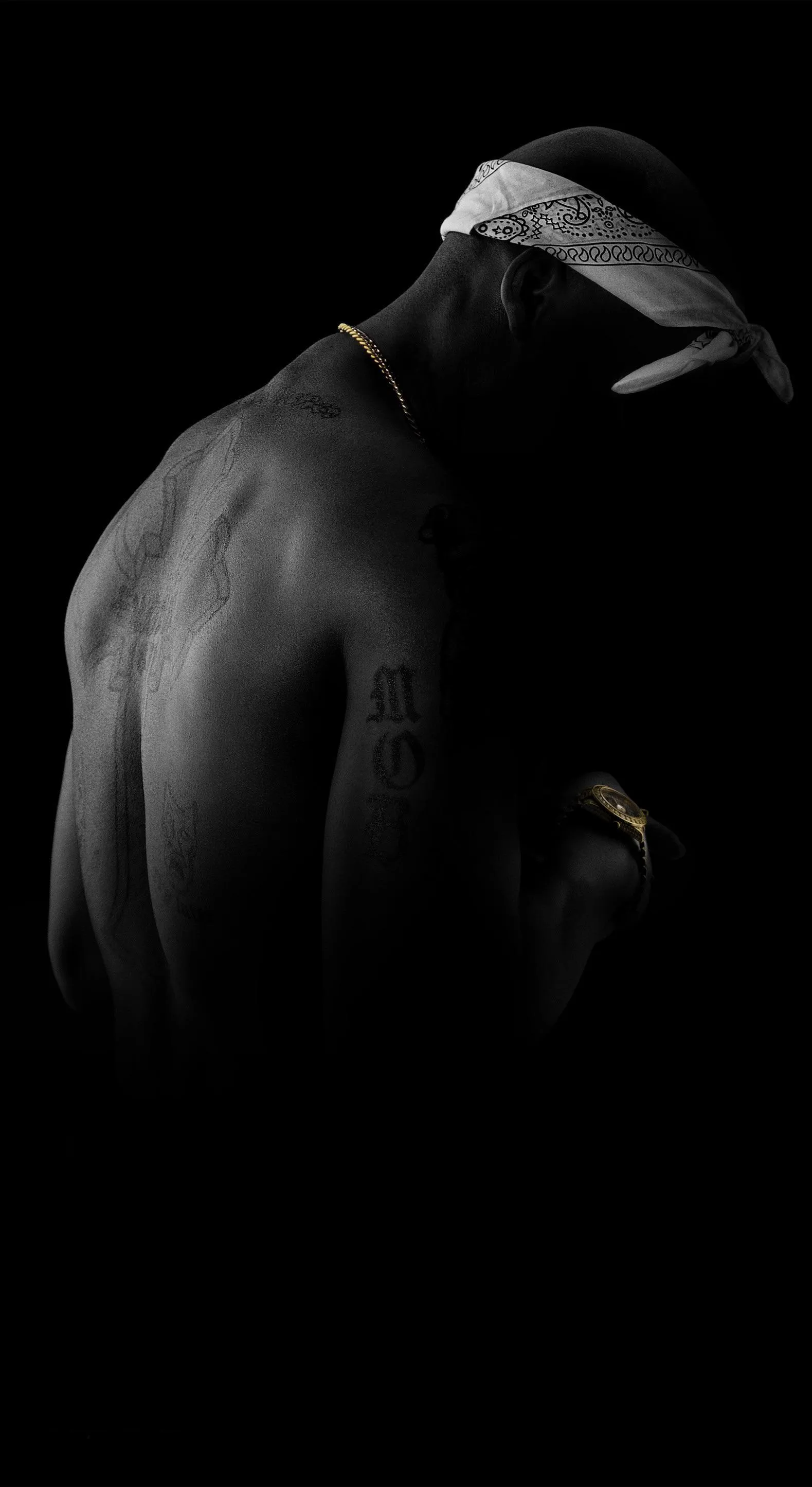 Mysterious Man with Dramatic Lighting and Shadow Wallpaper