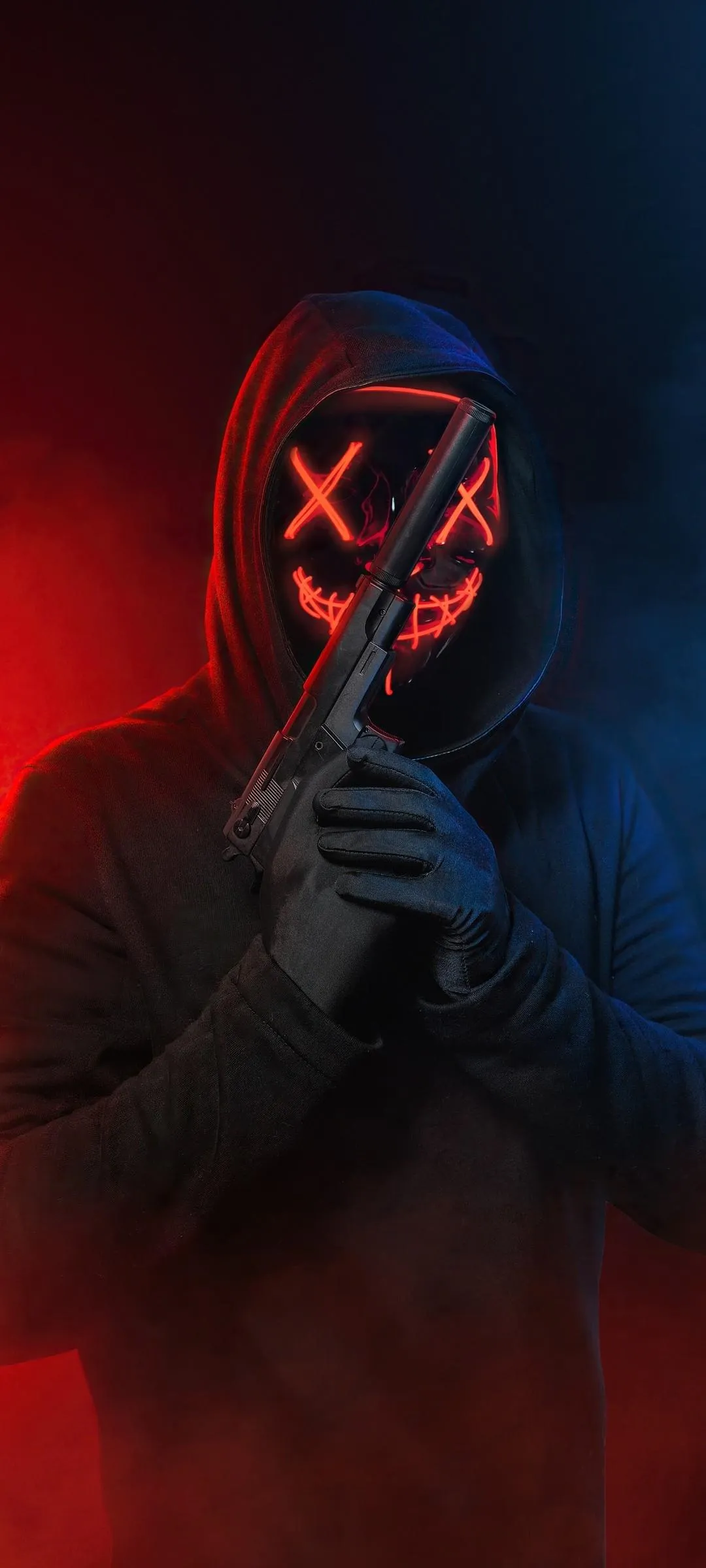 Mysterious Masked Figure in Red and Blue Lighting Wallpaper