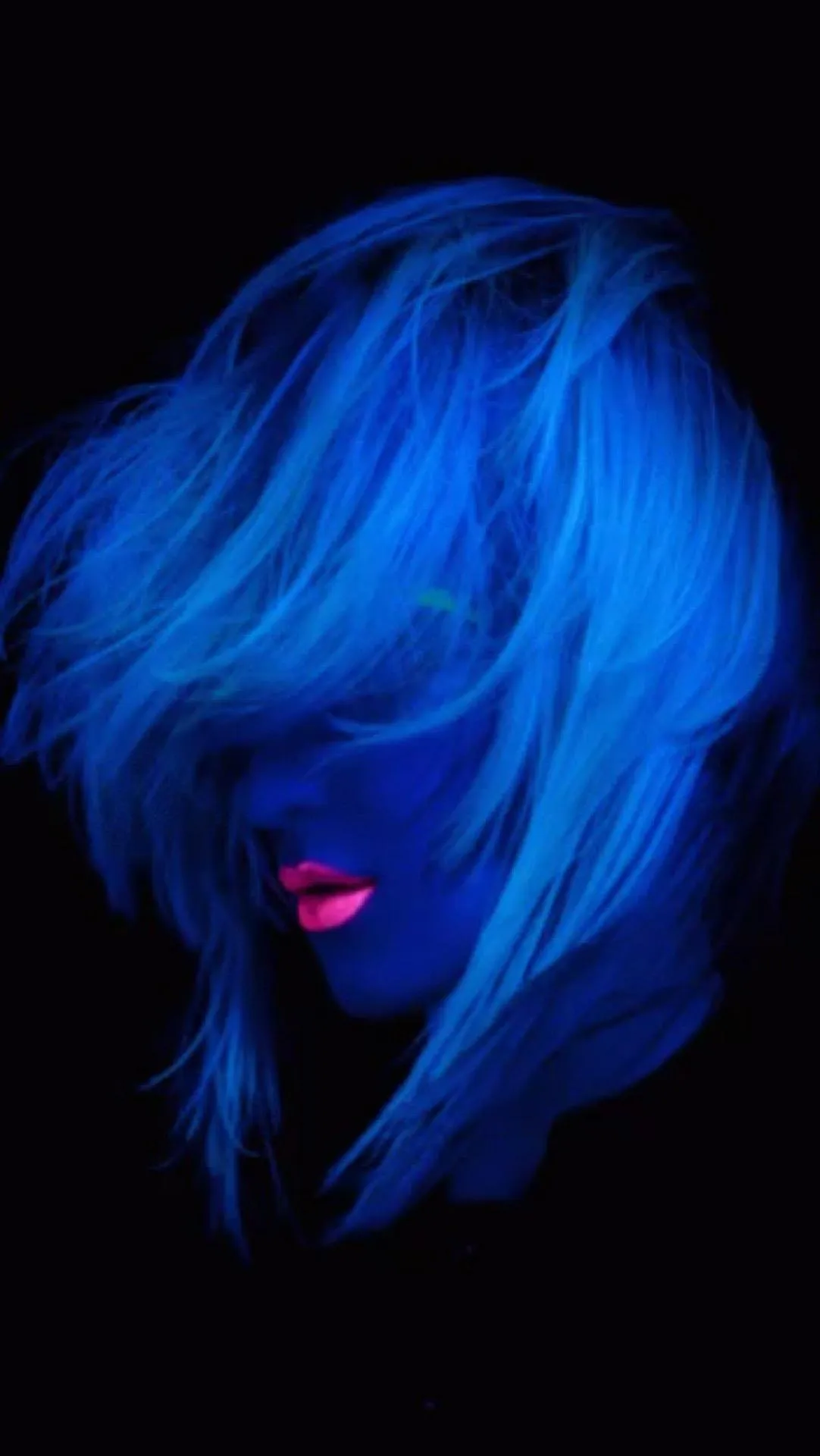 Mysterious Portrait in Neon Blue Artistic Lighting