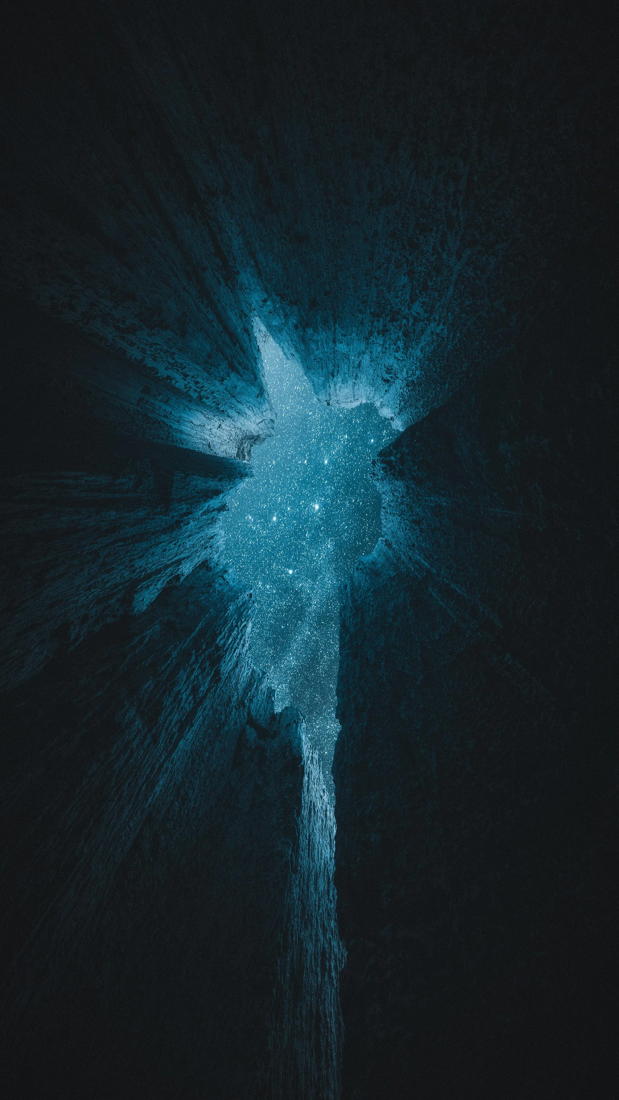 Mystical View of a Starry Sky Seen From a Deep Rock Cavern