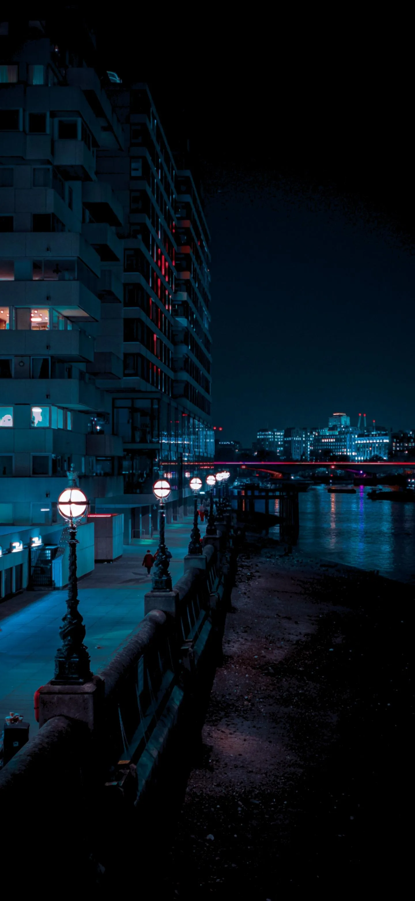 Neon Lit Alleyway Scene With Lone Figure In Blue Glow
