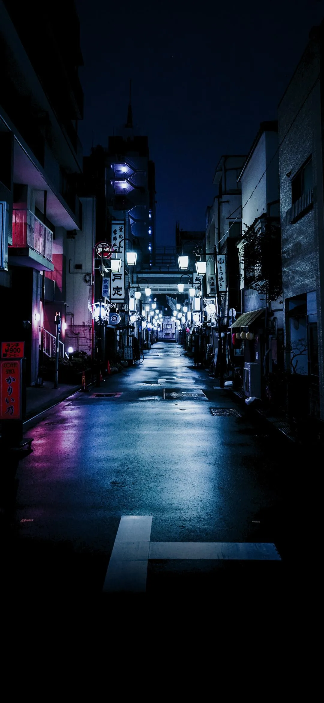 Neon Lit Empty City Street With Moody Urban Vibes Wallpaper