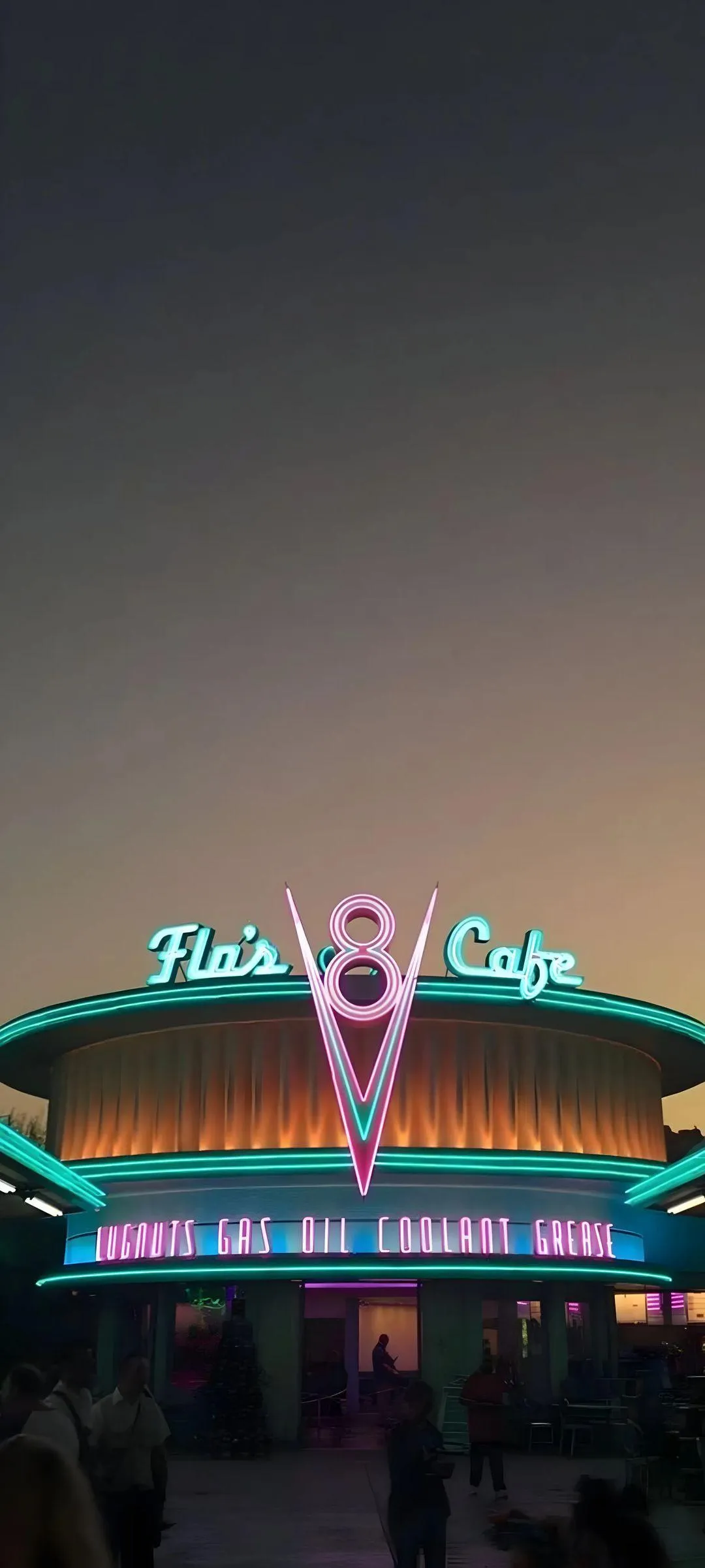 Neon Lit Retro Themed Cafe Glowing Under Evening Sky