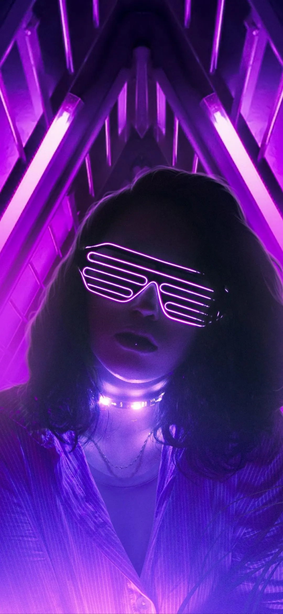 Neon Purple Masked Person Wearing LED Glasses In Dark Room