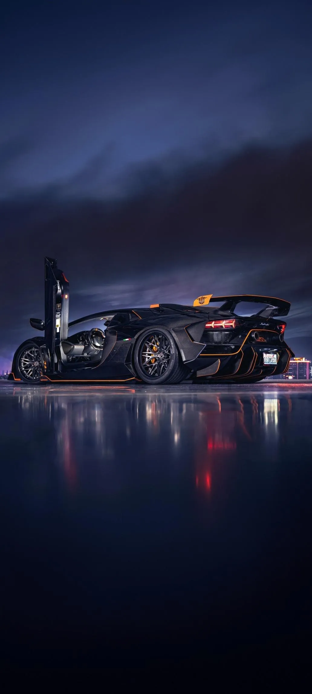 Night City Reflection with Car on Calm Water Photography