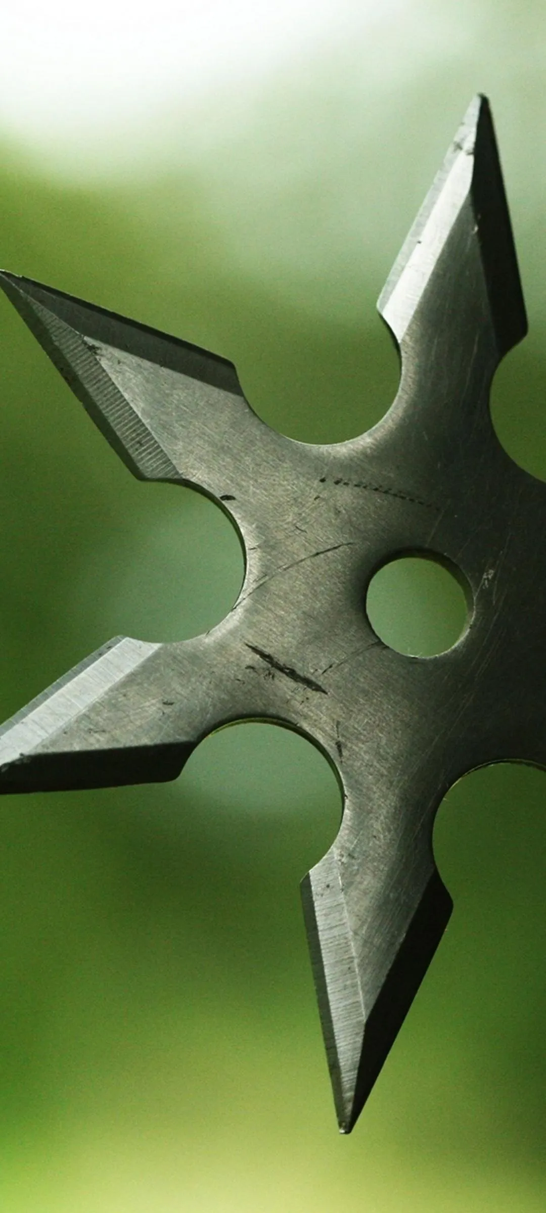 Ninja Star Green Metallic Weapon Design Wallpaper Background