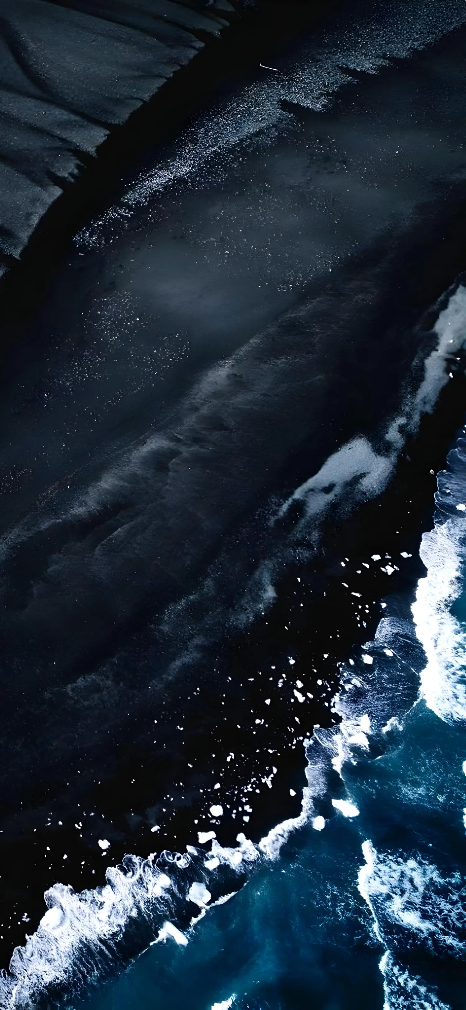 Ocean Wave Crashing with White Foam on Rocky Shoreline