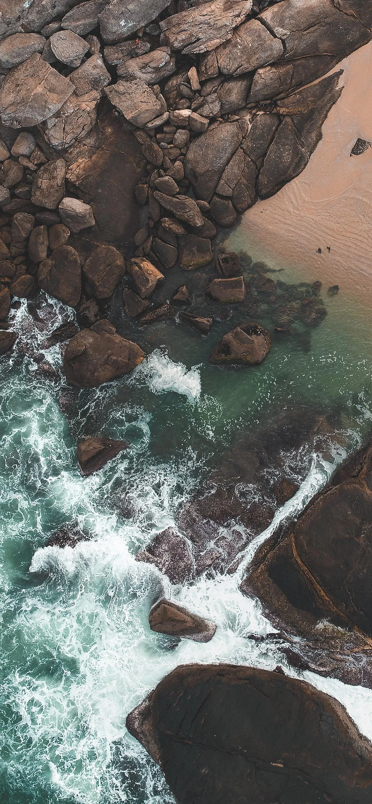 Ocean Waves Crashing on Rocky Shore Aerial View Wallpaper