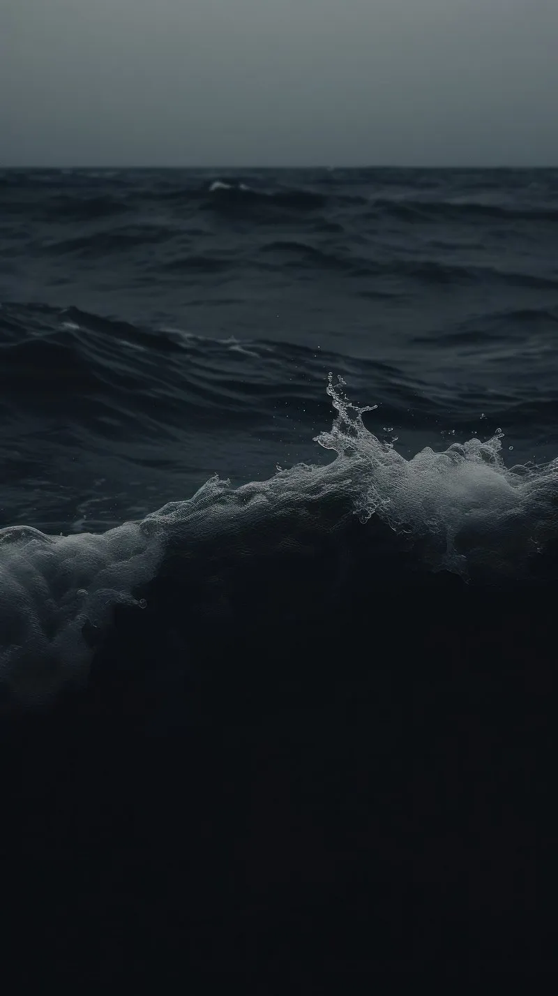 Ocean Waves Rolling under a Dark and Moody Stormy Atmosphere