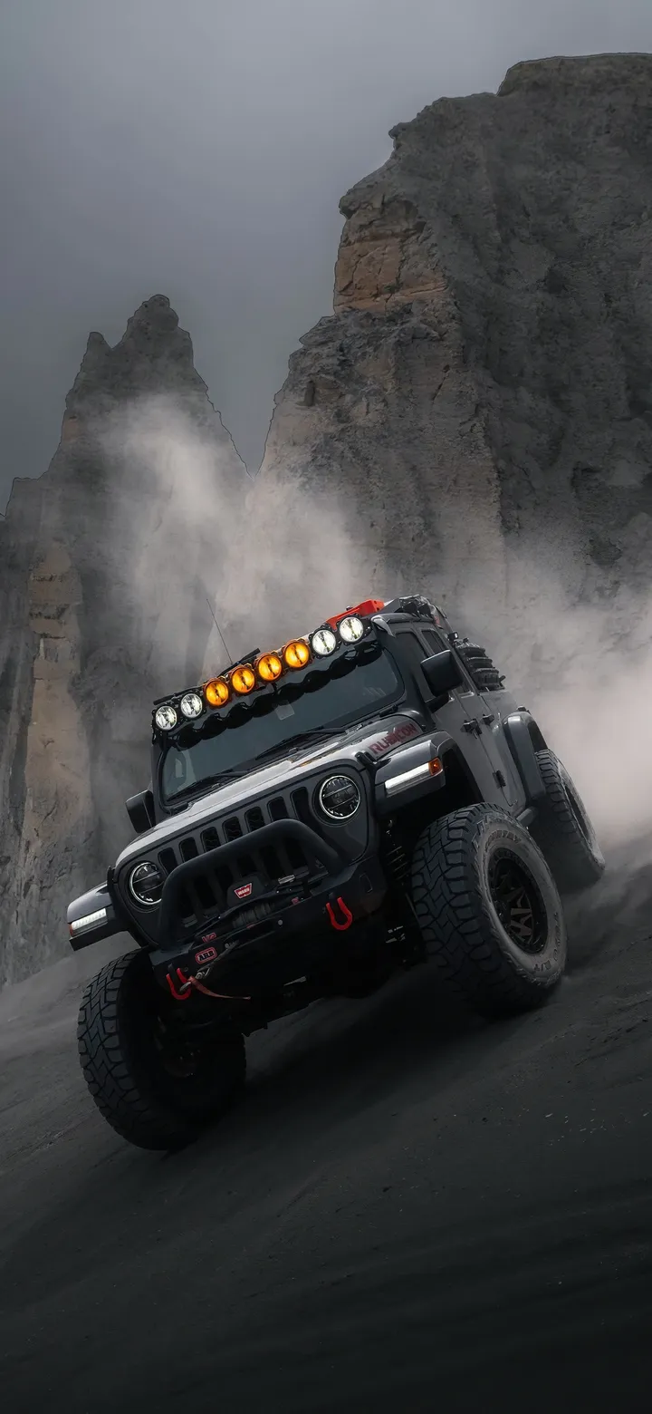 Offroad Vehicle Driving Through Dust Cloud on Rough Terrain