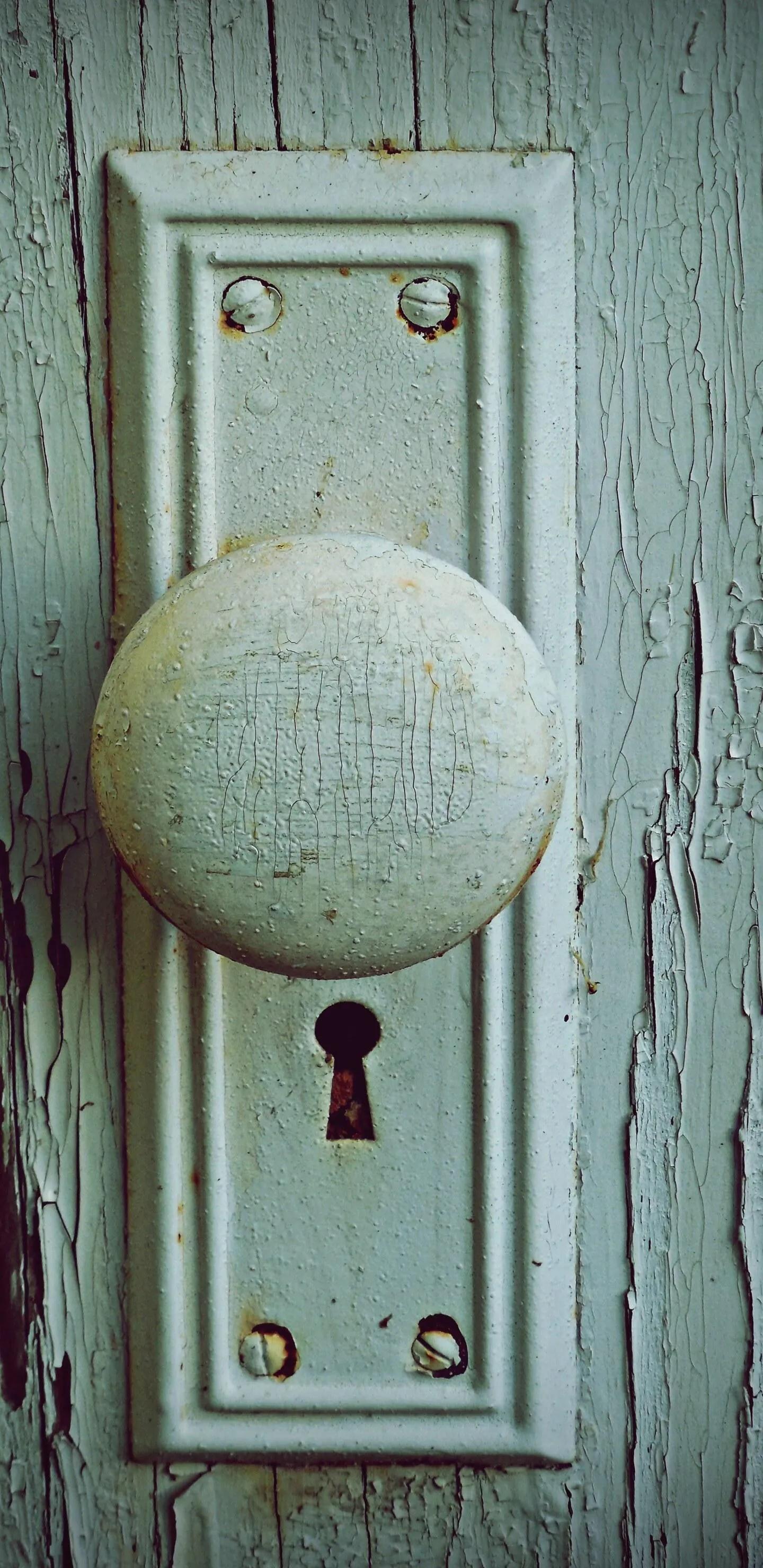 Old White Wooden Door with Round Doorknob and Keyhole