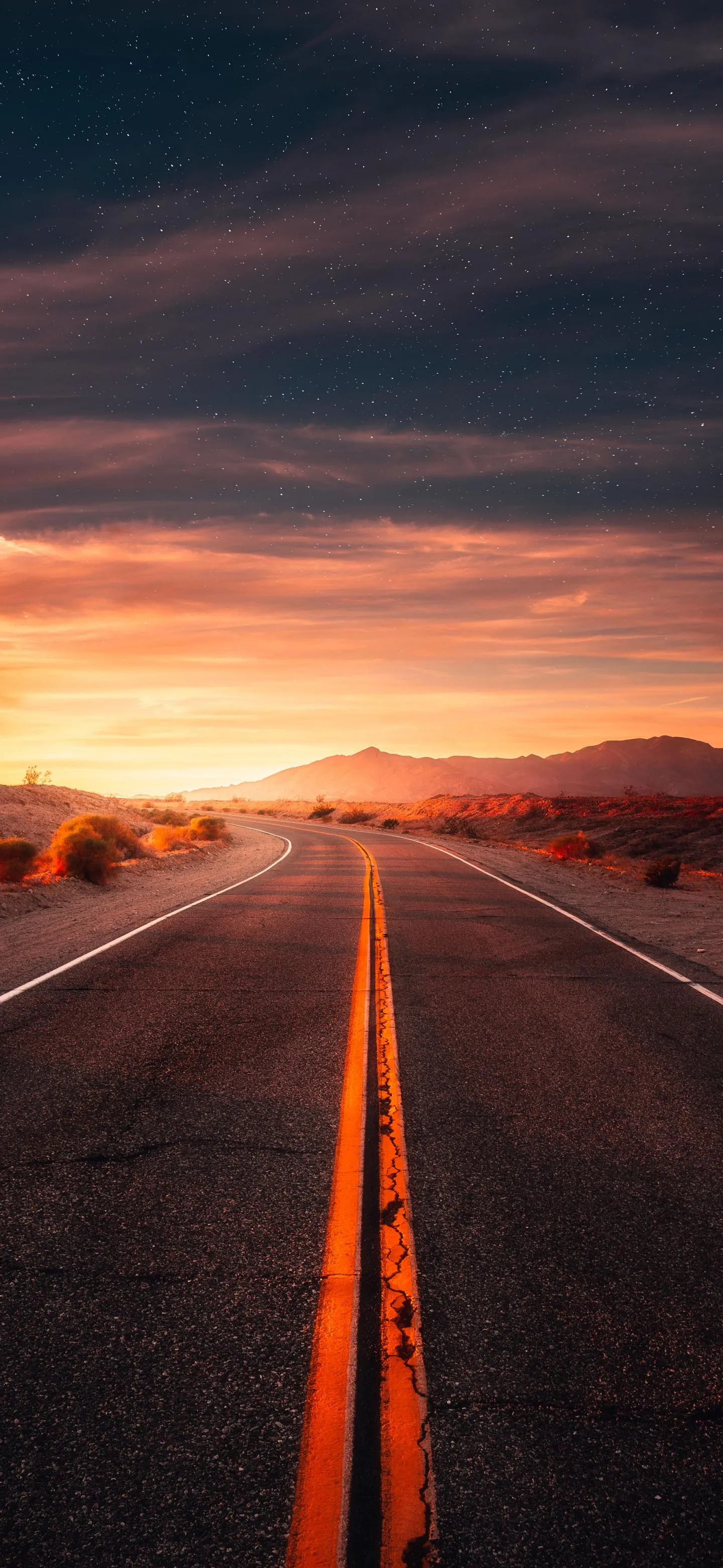 Open Road at Sunset with Stunning Orange Sky View Image