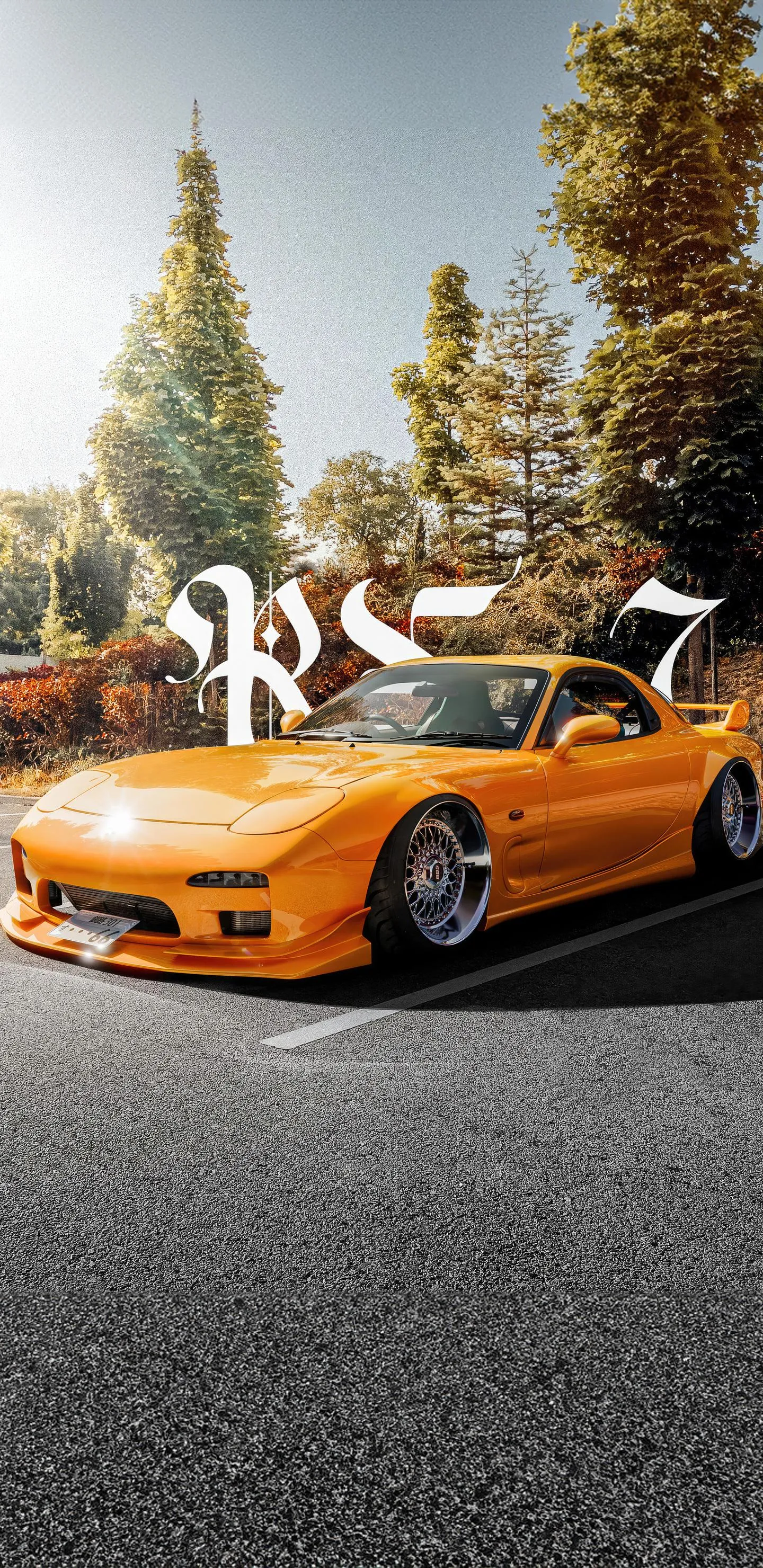 Orange Sports Car Driving on City Street Lined with Trees