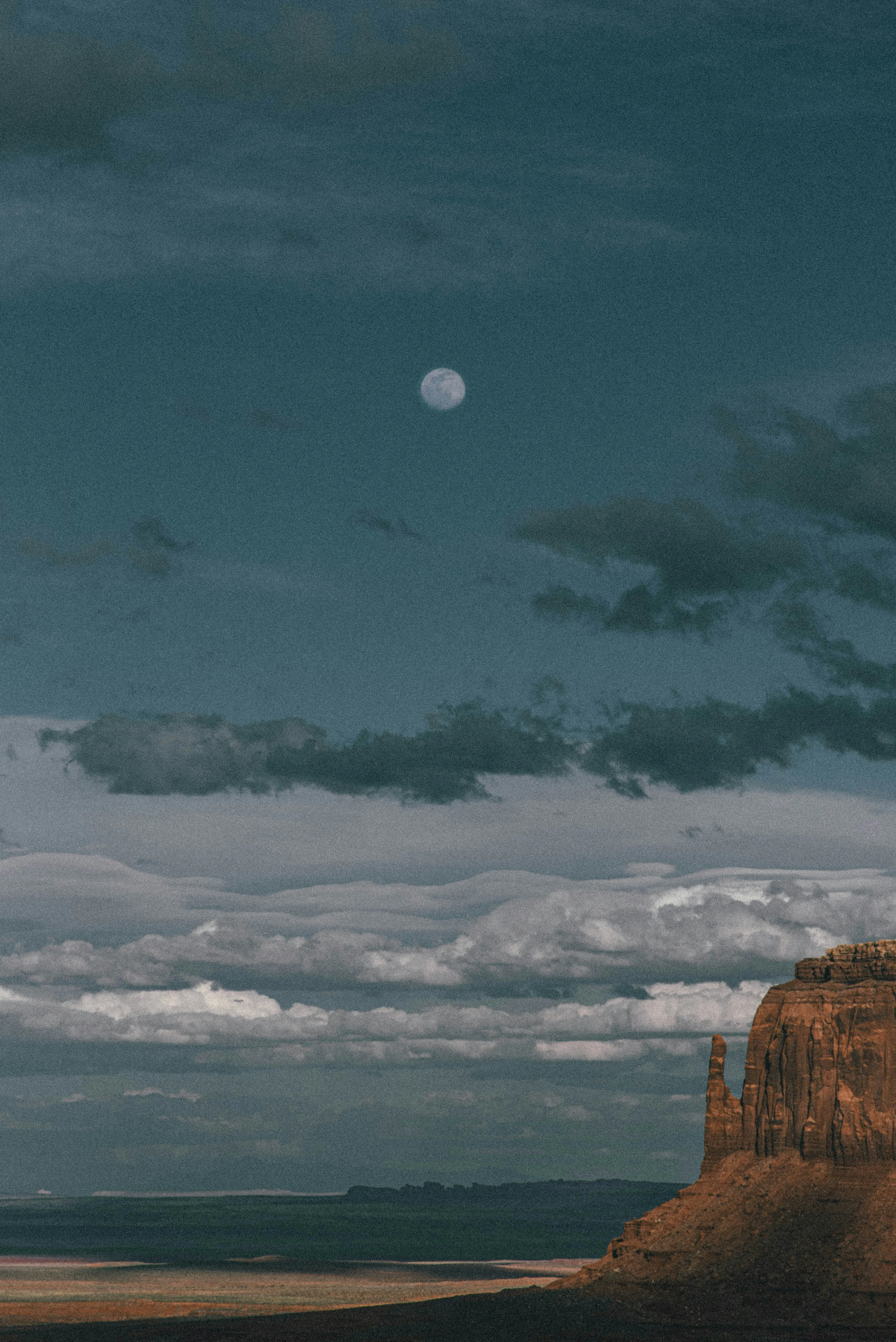 Peaceful Coastal Cliffs Under Cloudy Grey Sky View
