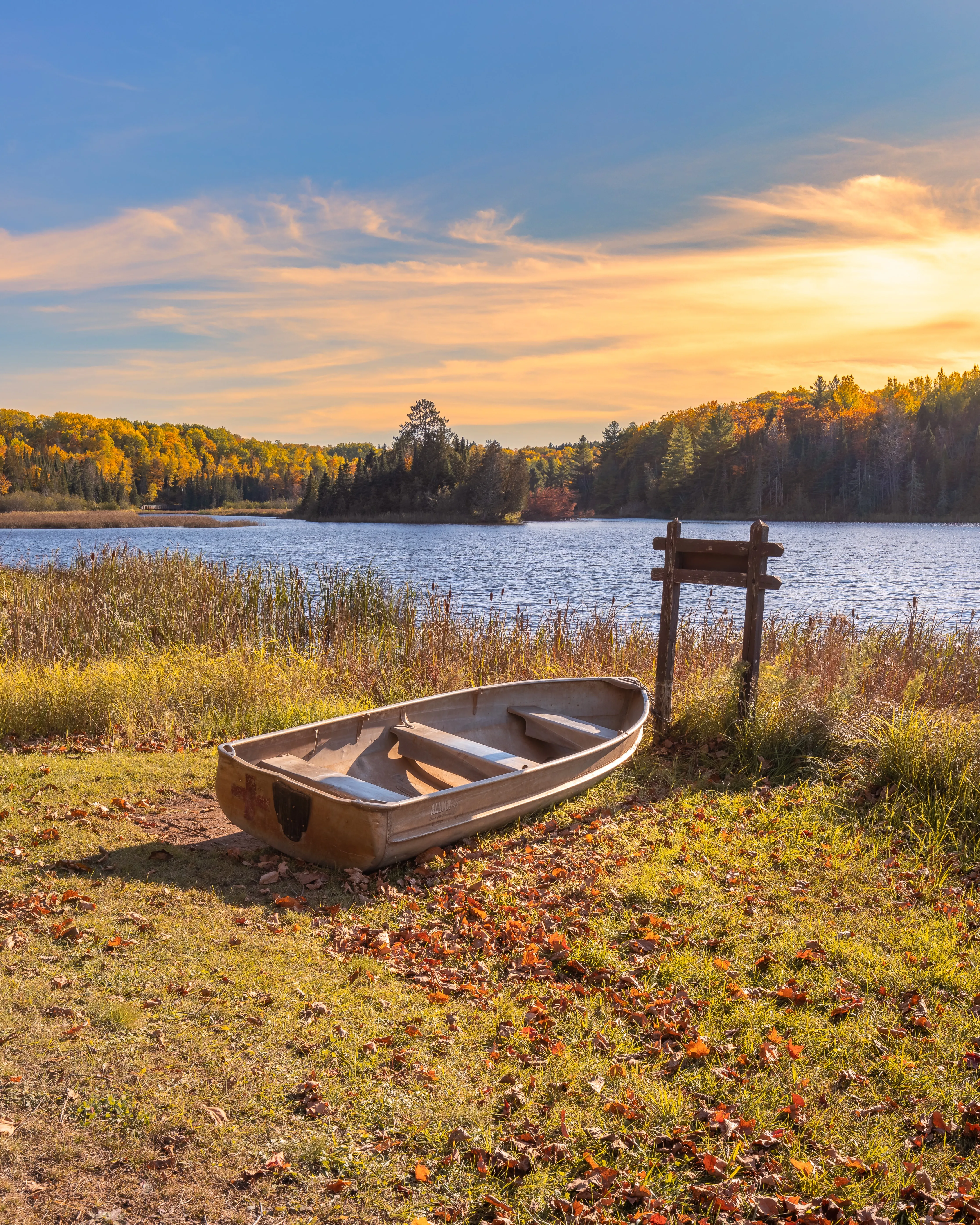Peaceful Lake Dock at Sunrise with Calm Water Wallpaper