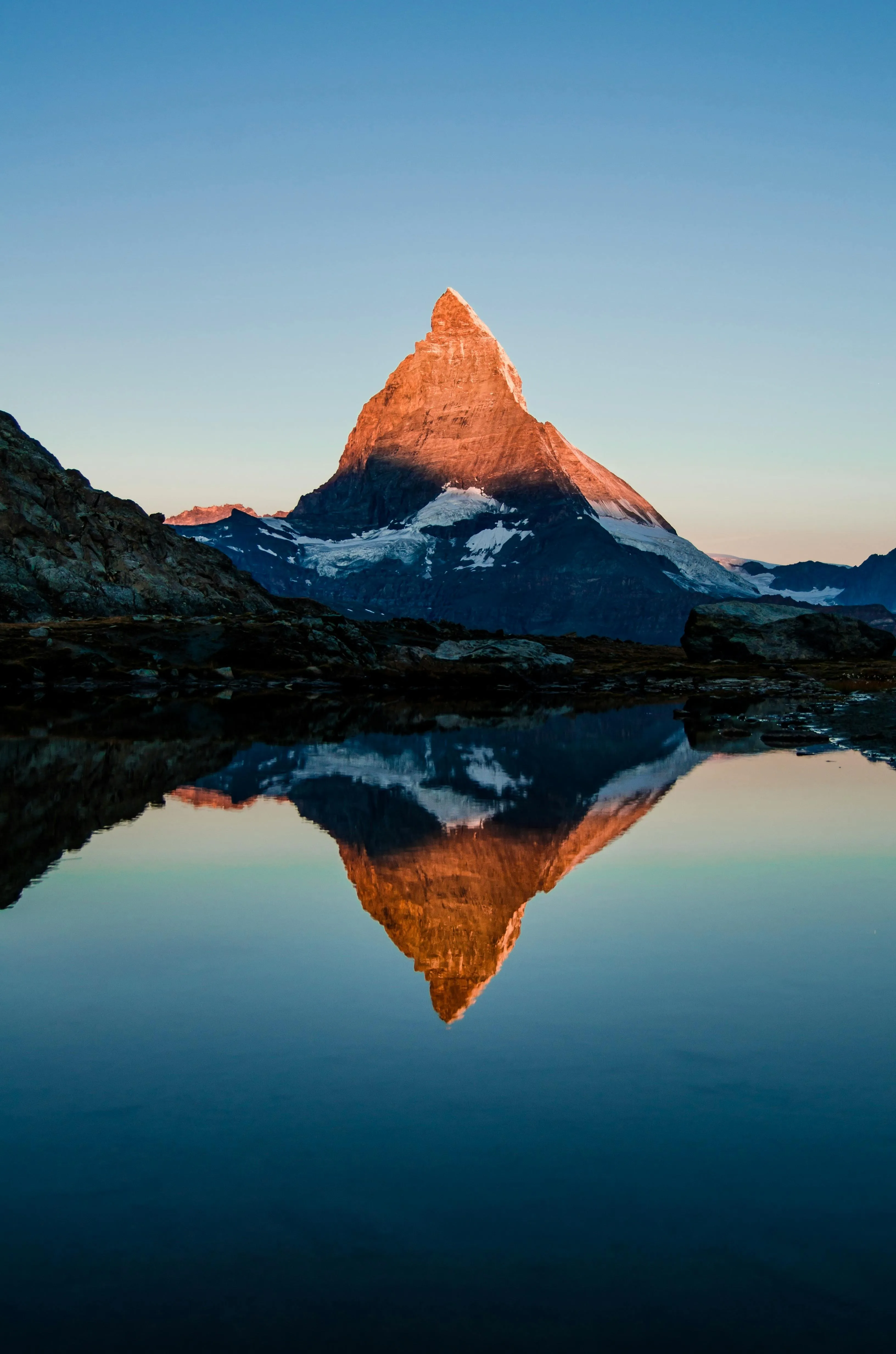 Peaceful Mountain Reflection Glowing at Vibrant Sunrise